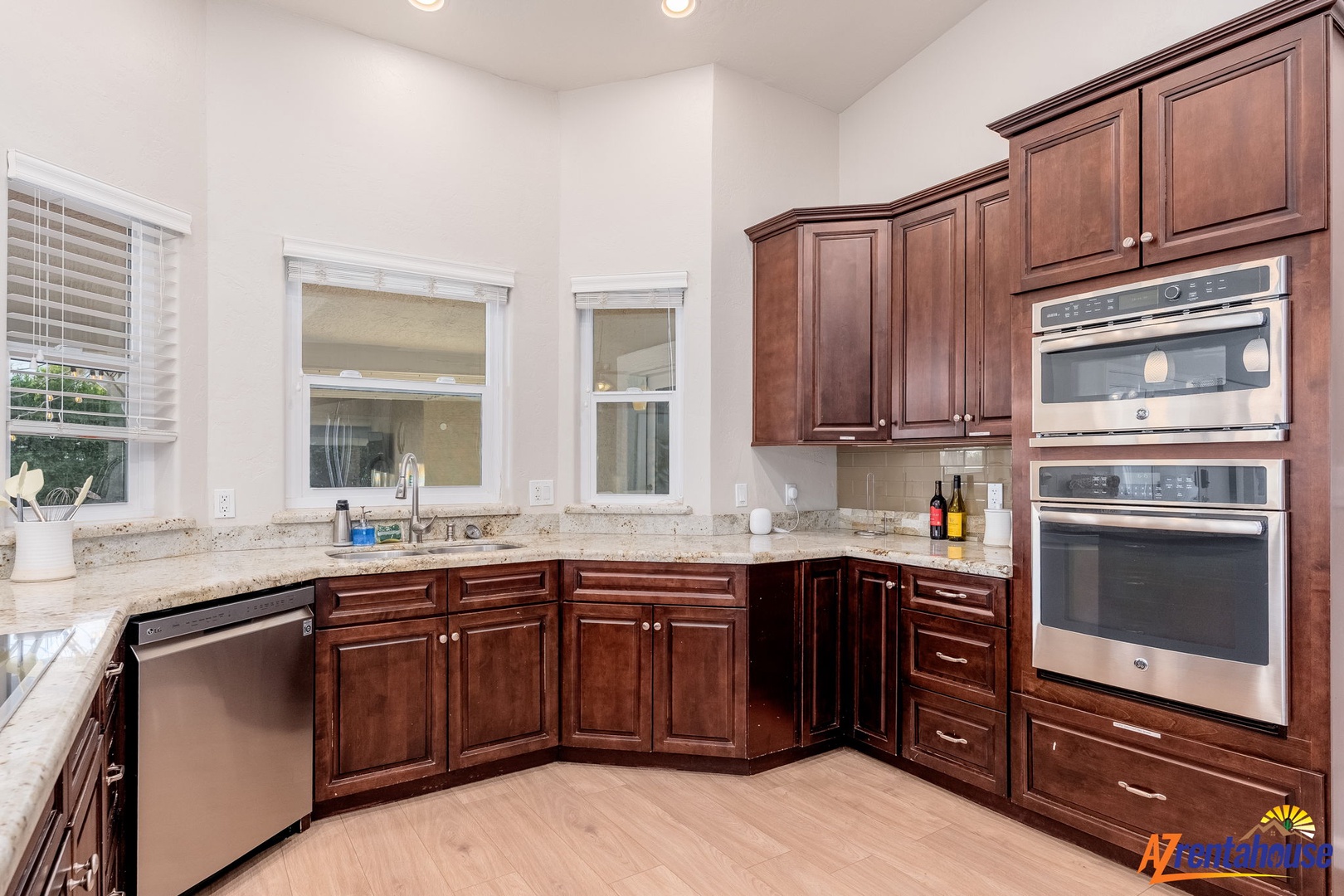Prepare your favorite meals in this spacious, fully equipped kitchen with modern appliances, granite countertops, and ample cabinet space for all your culinary needs.