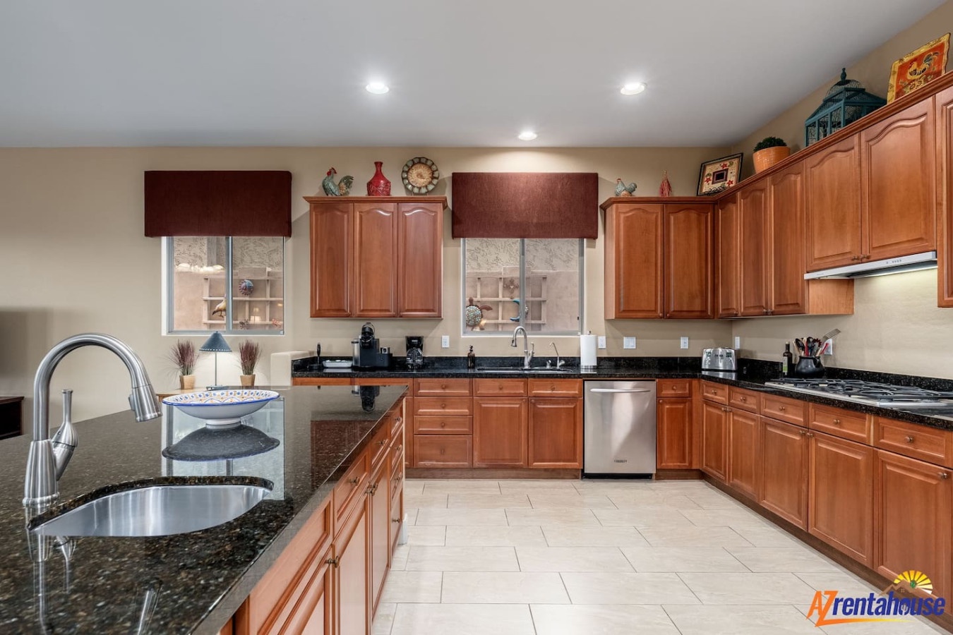 Cook memorable meals in your spacious kitchen featuring rich wood cabinetry, gleaming granite countertops, and modern stainless appliances ready for culinary adventures.