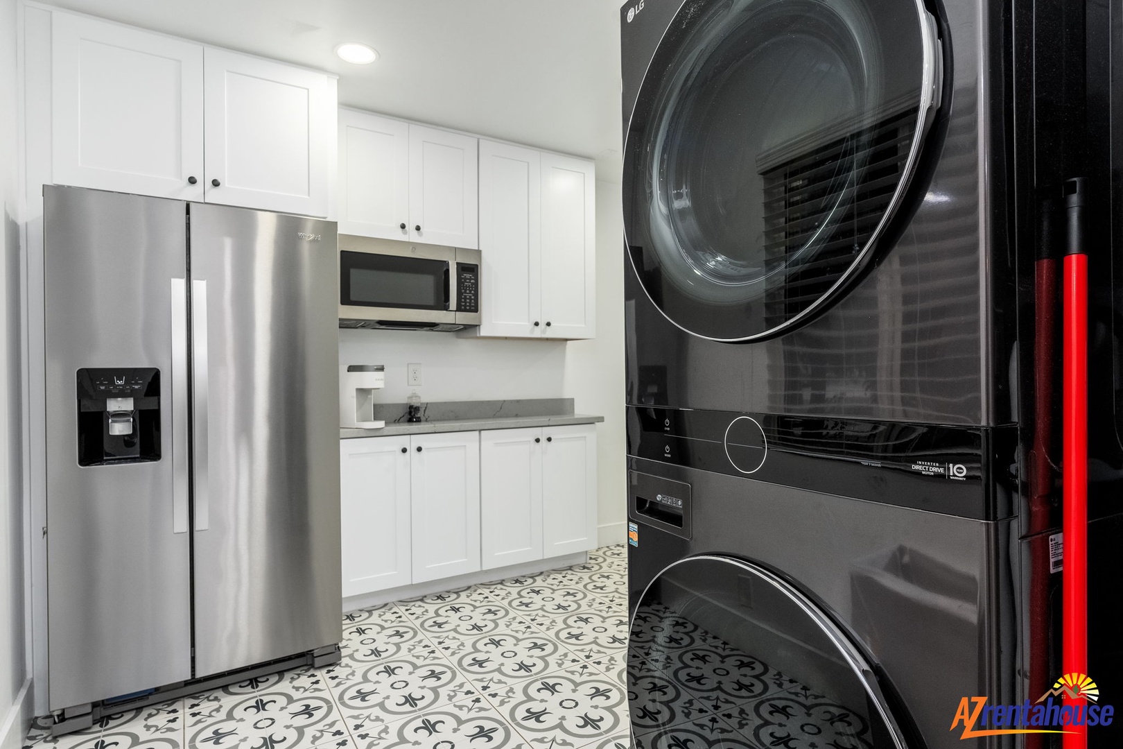 Your fully equipped laundry room features stainless steel appliances and crisp white cabinetry for all your cleaning needs.