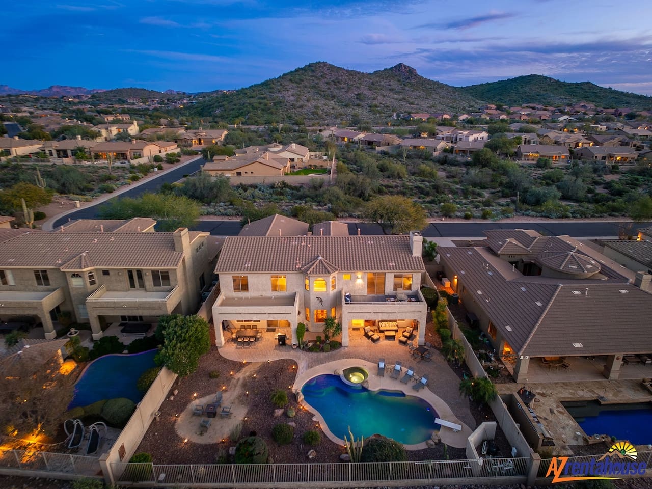 Stunning desert estate nestled in Scottsdale foothills, featuring luxury amenities and mountain views in an exclusive neighborhood setting.