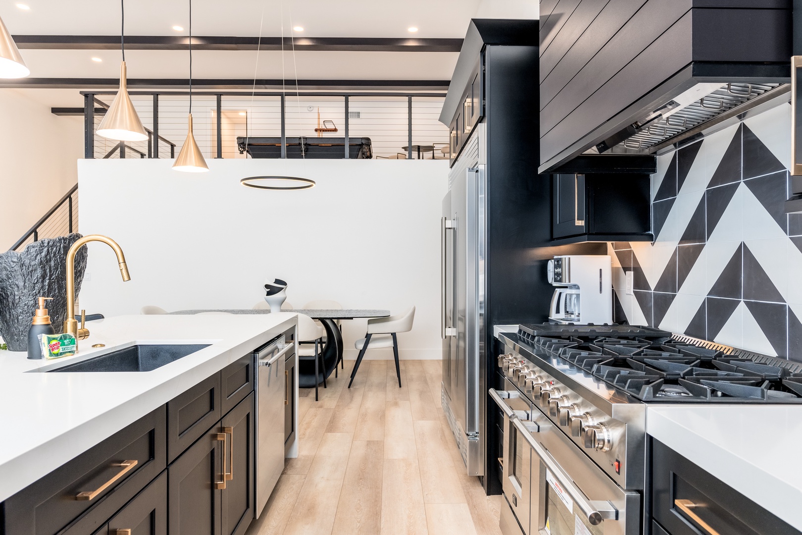 You'll love creating meals in this modern, fully equipped kitchen with professional-grade appliances, stylish finishes, and thoughtful design touches throughout.