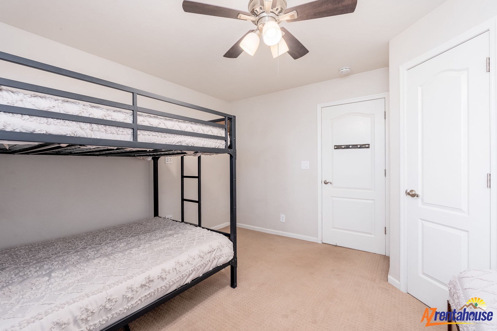 Unwind in your cozy bedroom with comfy bunk beds, a ceiling fan to keep you cool, and plenty of space to make yourself at home.