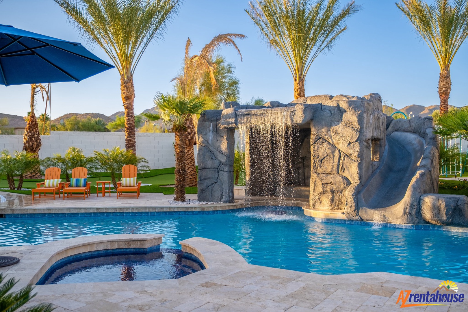 Dive into luxury with your private pool featuring a stunning rock waterfall, spa, and tropical palm-lined paradise.