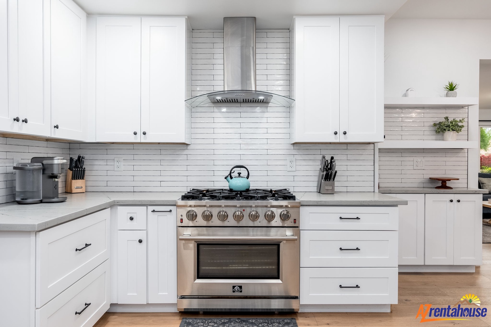Your culinary dreams come alive in this bright, modern kitchen with sleek white cabinetry and professional-grade appliances.