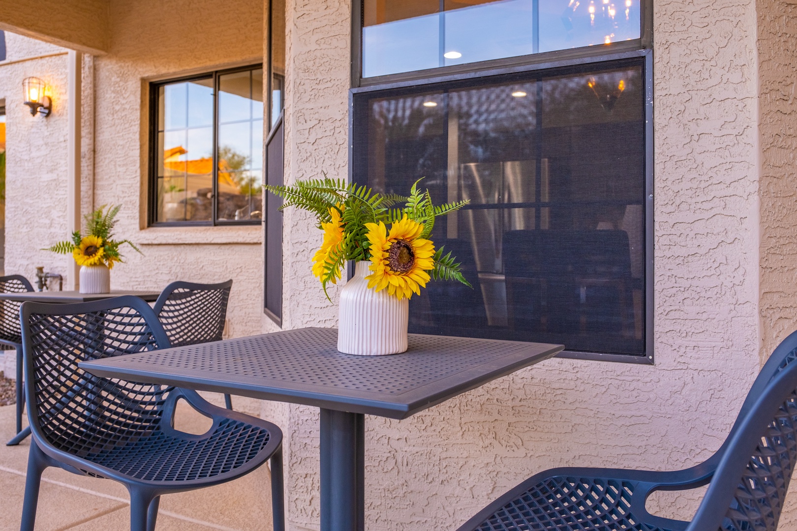 Enjoy your morning coffee at this covered outdoor dining space, perfect for soaking in the warm Arizona sunshine and fresh air.