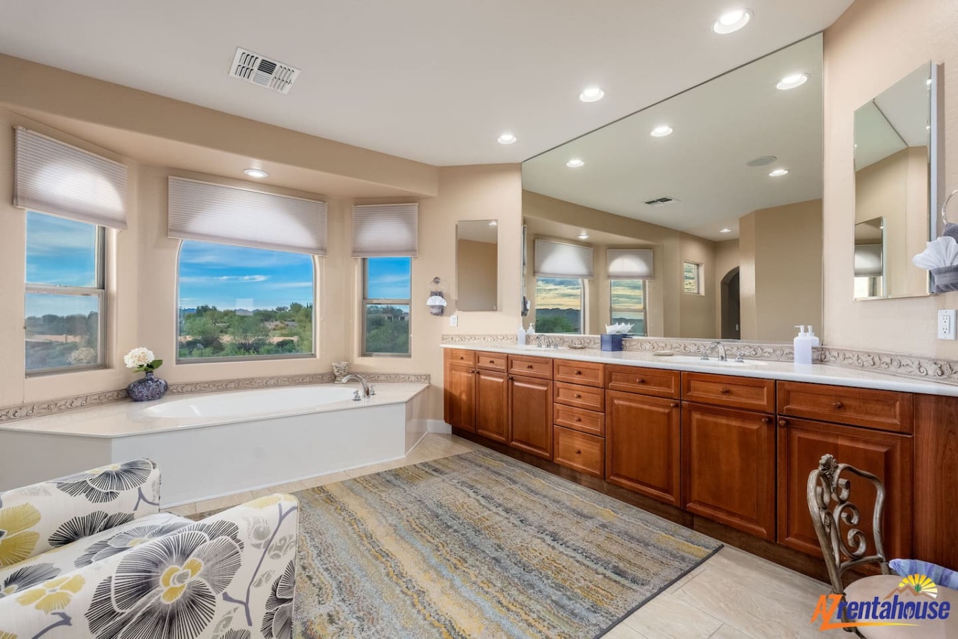 Unwind in your luxurious master bathroom with a soaking tub positioned perfectly for scenic views while you relax.