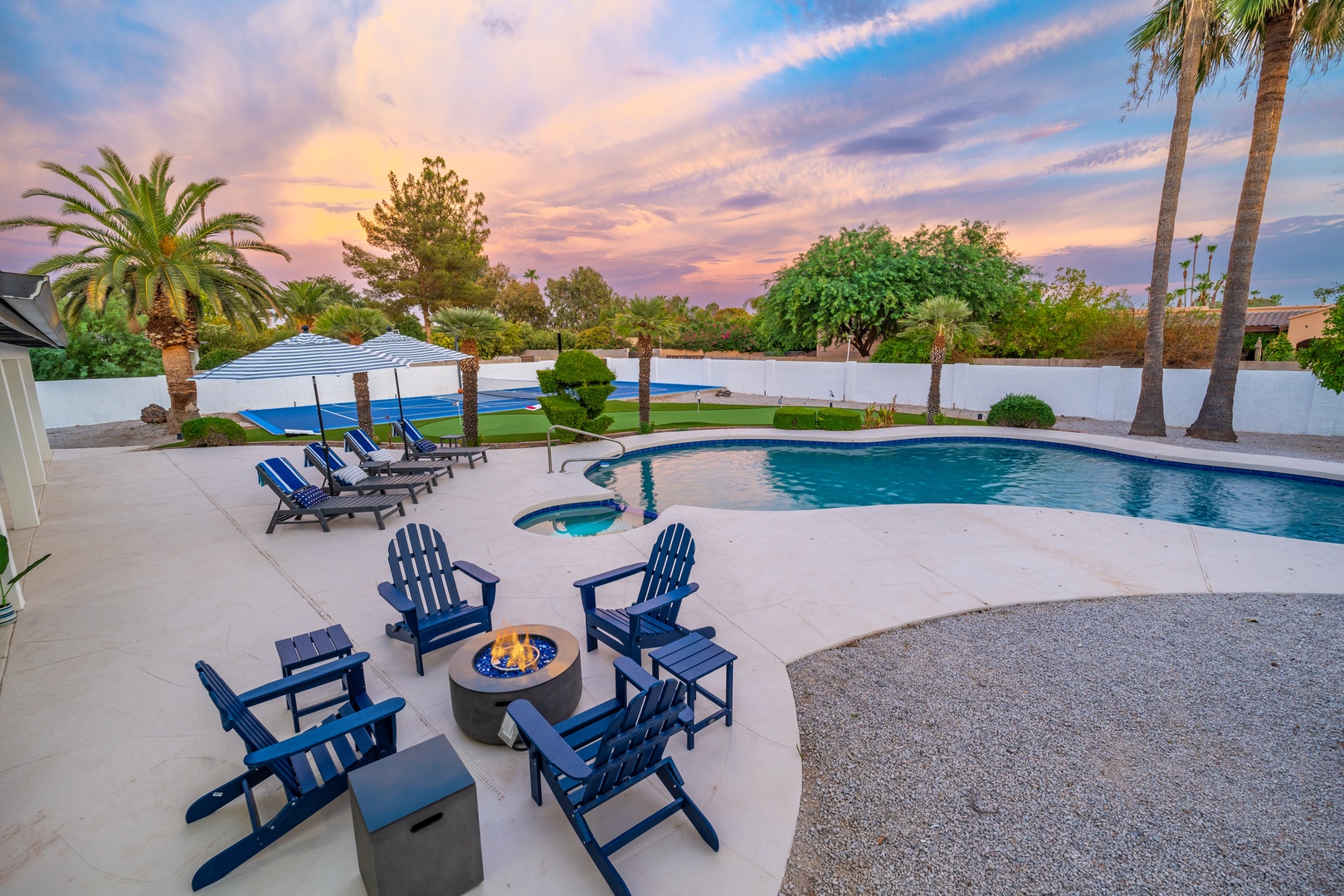 Picture yourself lounging by your private pool as the desert sky glows with stunning colors. Gather around the fire pit with loved ones, soak up the sun on comfy chairs, or take a refreshing dip. This backyard oasis is your perfect escape.