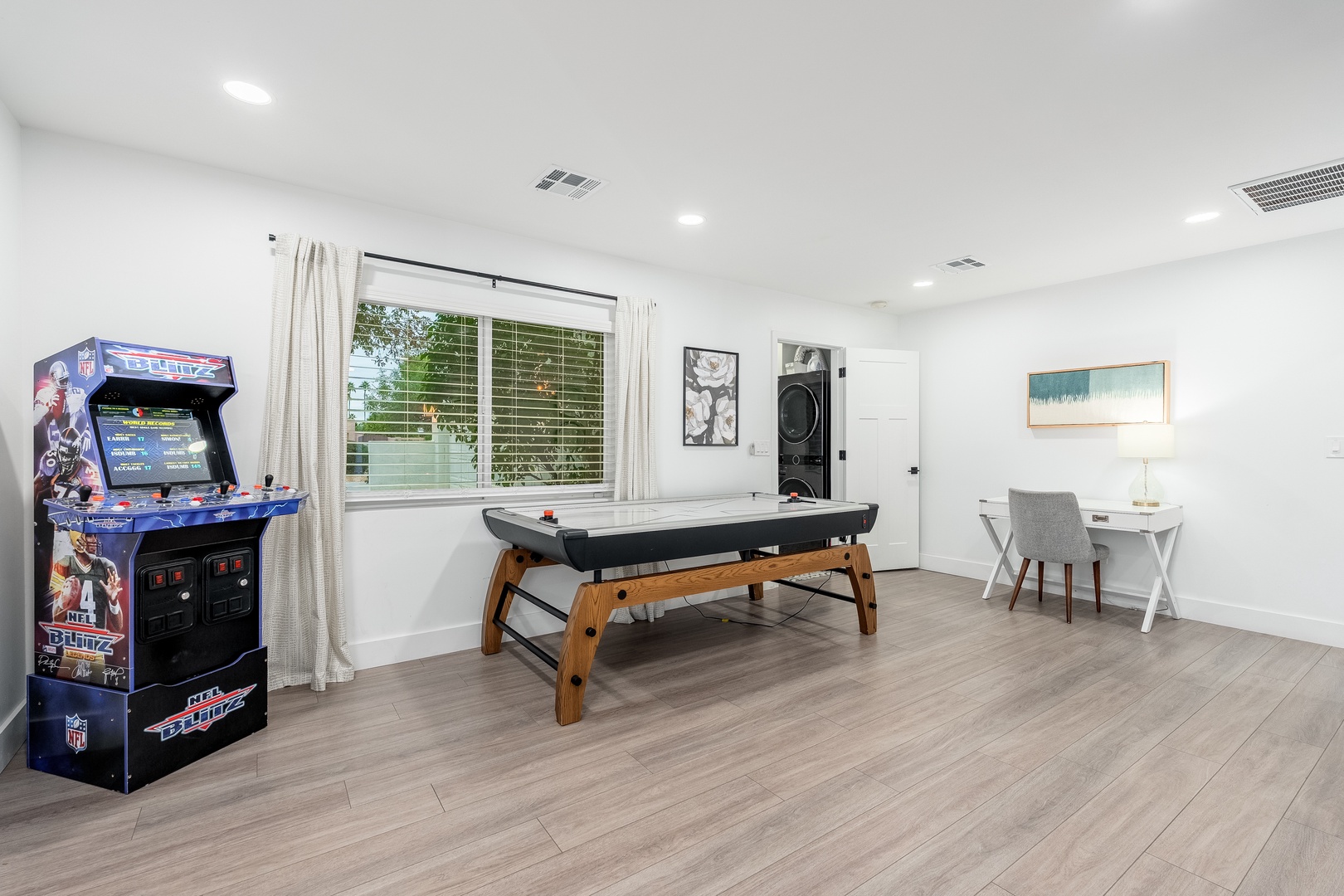 Enjoy friendly competition with your group in this bright game room, featuring arcade fun, air hockey, and a cozy dining nook—perfect for unwinding between adventures.