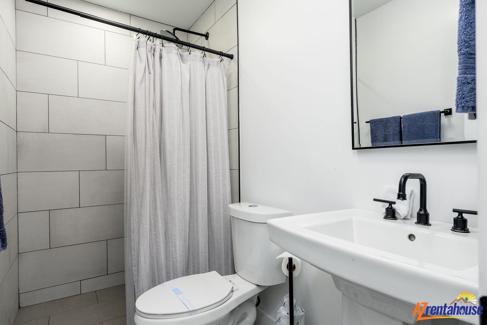 Your private bathroom features modern fixtures, a refreshing shower, and fresh towels ready for your stay.