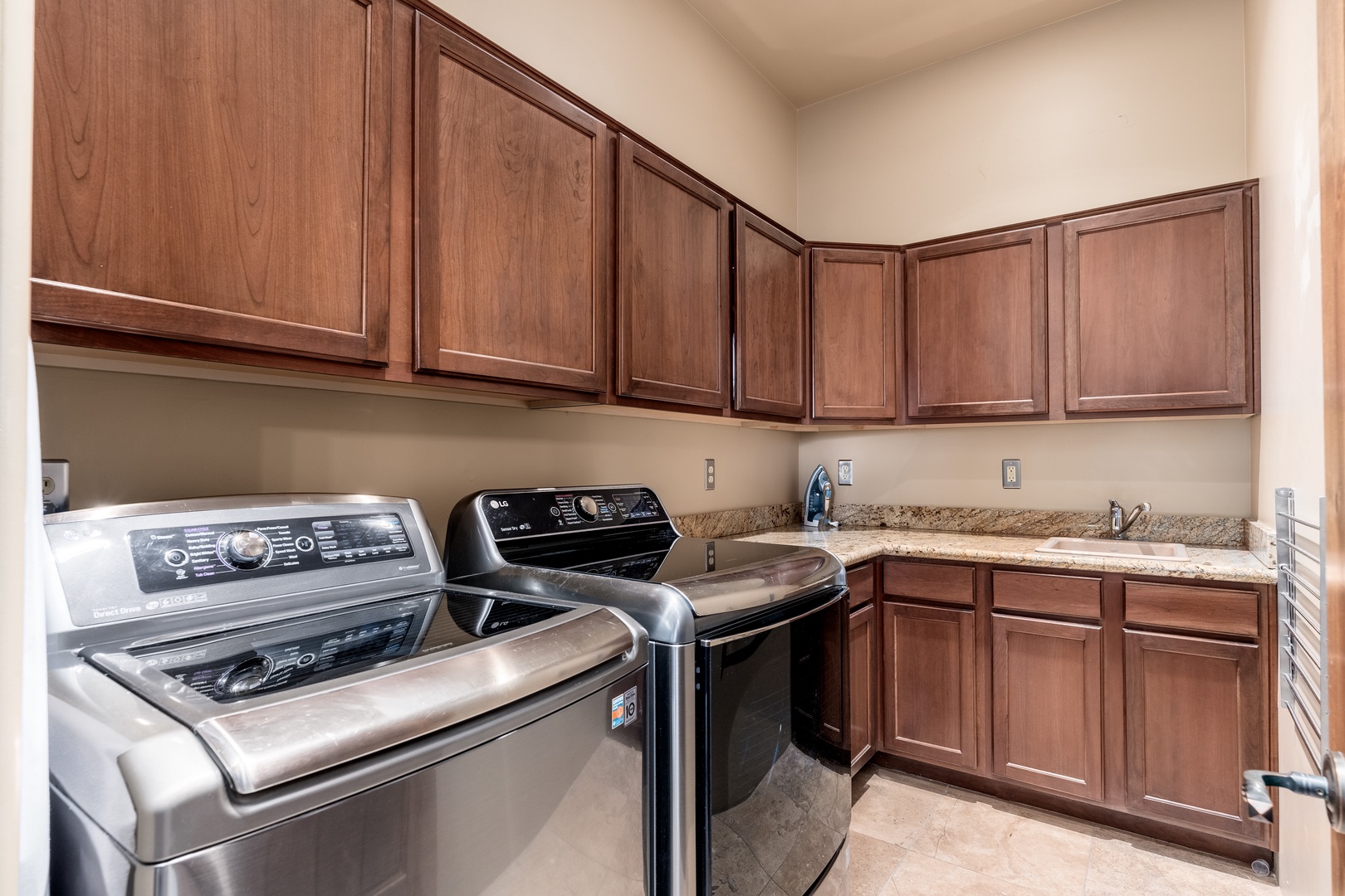 Your private laundry room features full-size appliances, granite counters, and ample cabinet space—making it easy to refresh your wardrobe during your stay.