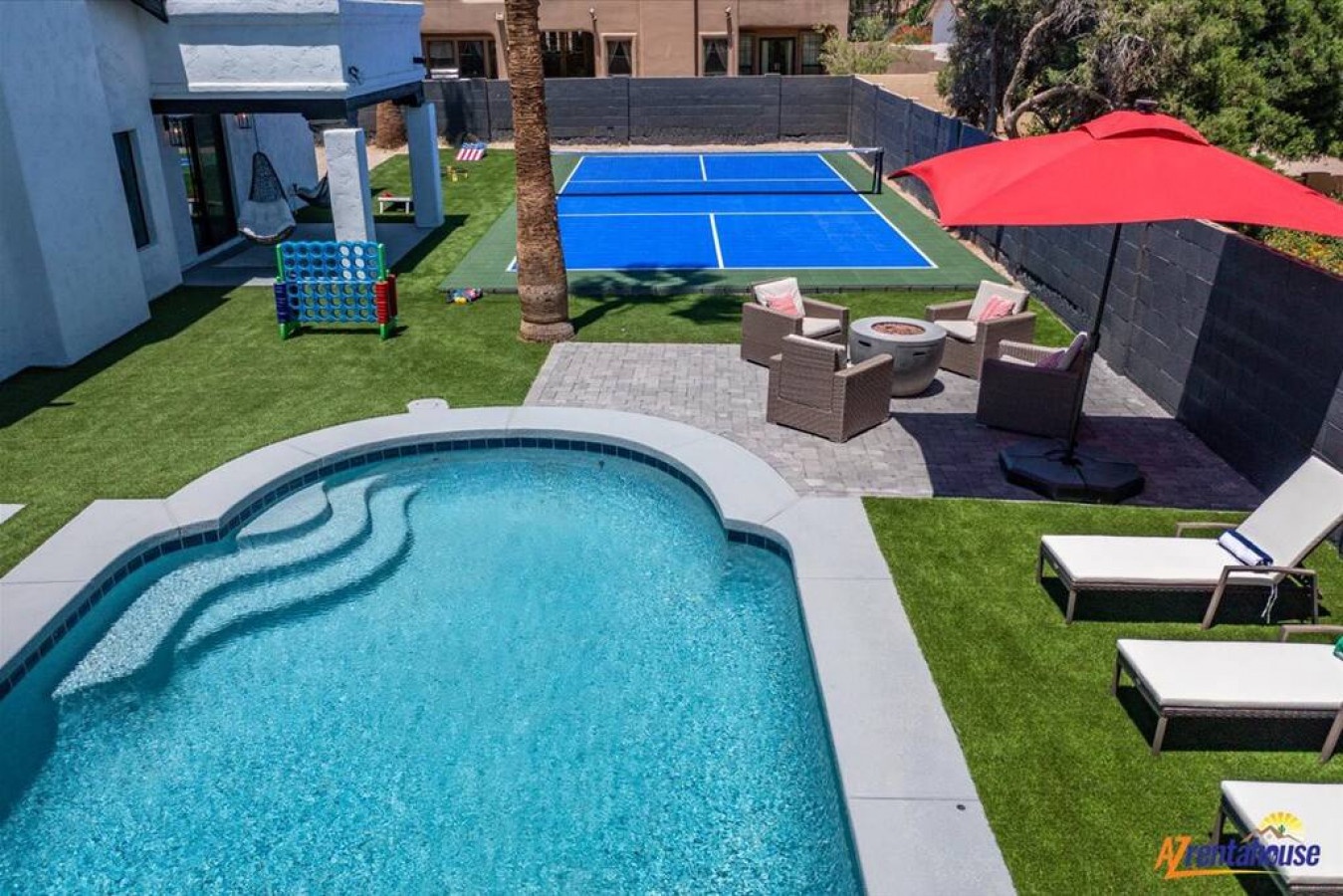 A private oasis featuring crystal-clear pool, tennis court, and sunny lounging areas perfect for your vacation getaway.