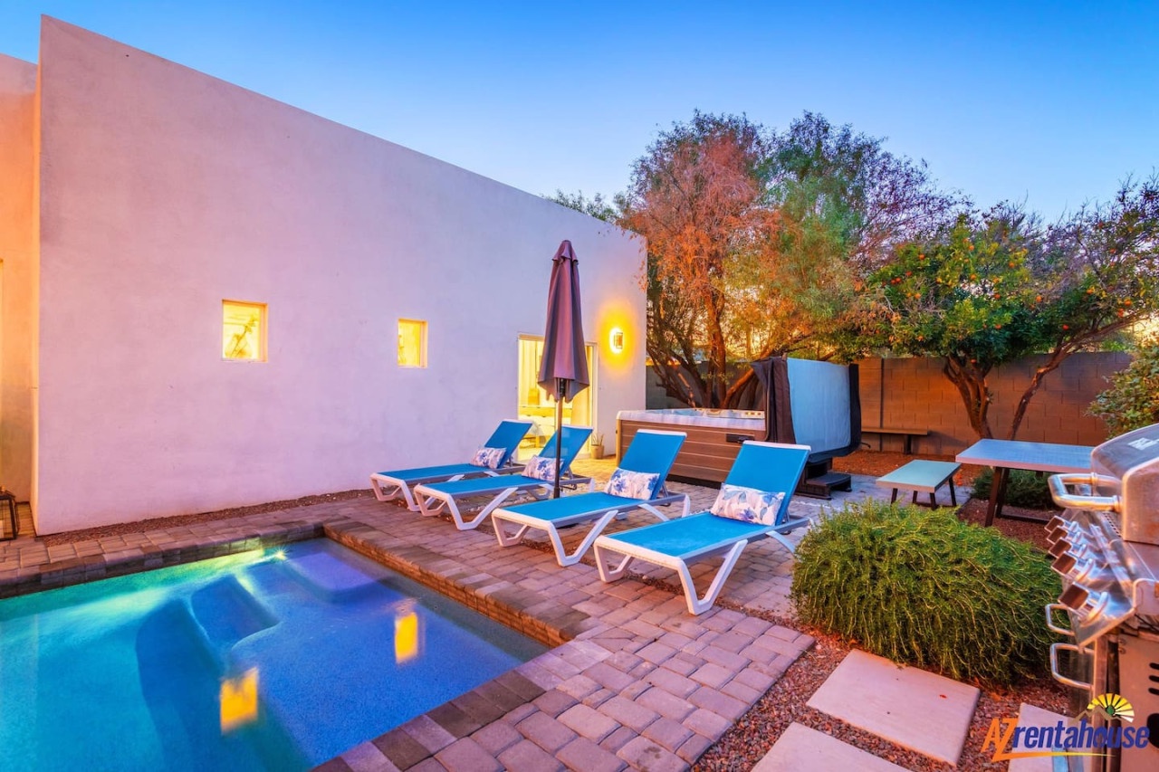 Your private pool glows under the warm evening lights while comfortable loungers await your relaxation in this tranquil courtyard oasis.