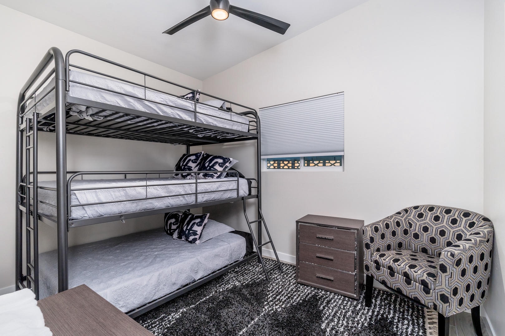Sleep soundly in this cozy bunk room, perfect for kids or extra guests. The modern design and comfortable bedding make it a fun, functional space for your stay.