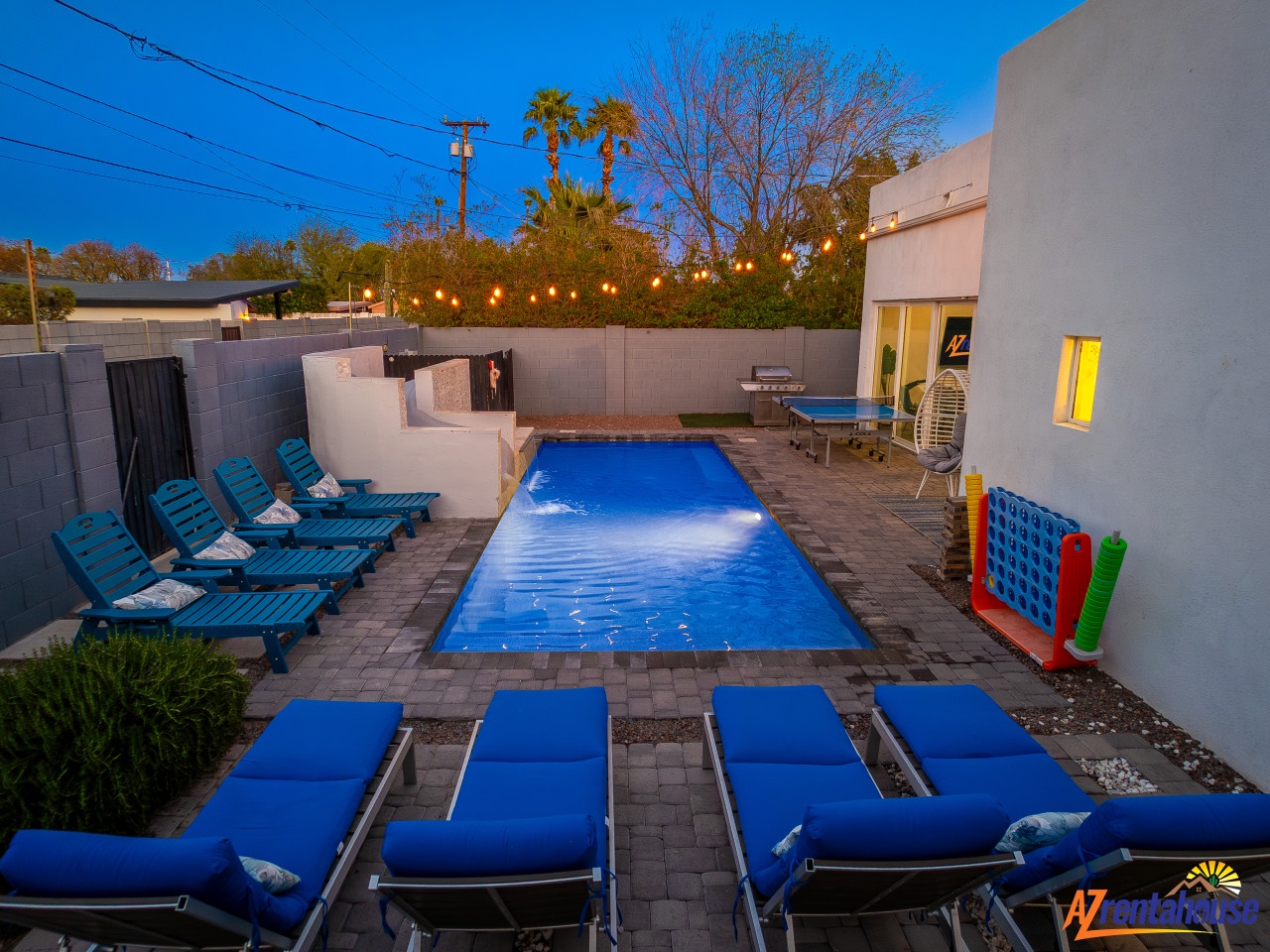 Dive into your private pool paradise with twinkling lights overhead and endless lounging spots for the whole group to enjoy together.