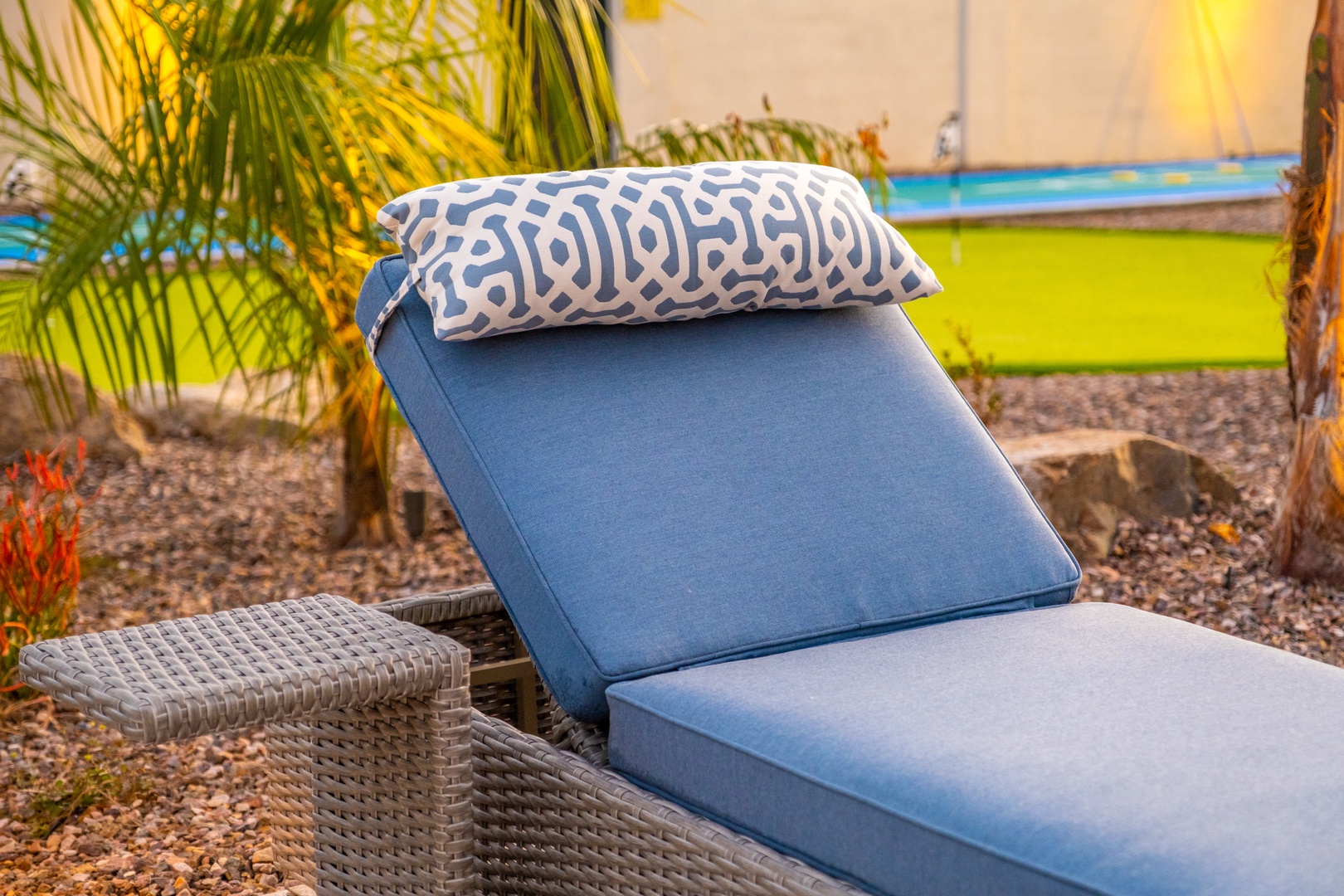 Picture yourself lounging here, soaking up warm rays on plush cushions, surrounded by lush tropical palms and vibrant pops of color—your perfect escape awaits.