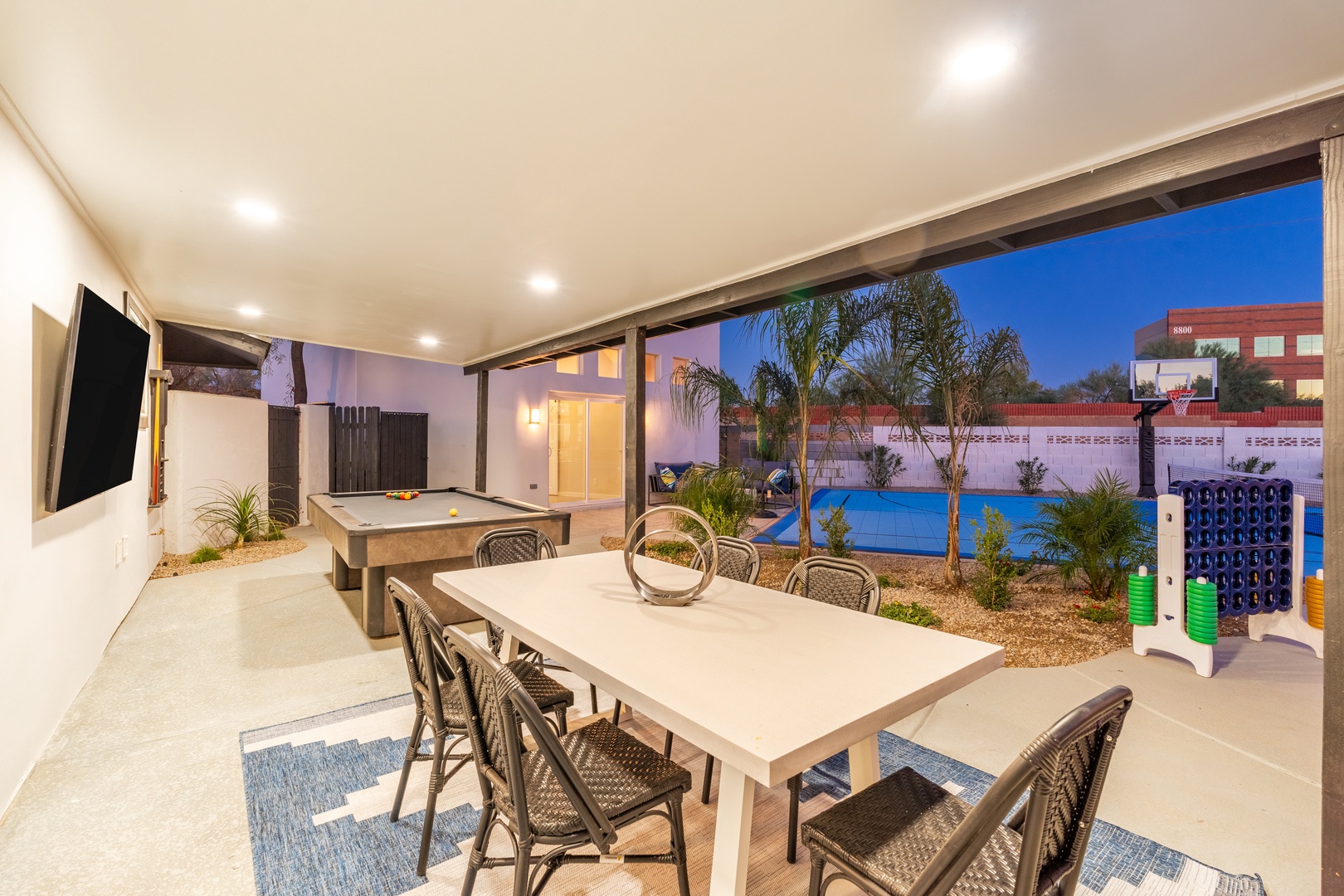 Your private entertainment oasis awaits under the evening sky. Gather around the dining table, challenge friends to pool, then cool off with a swim while the kids enjoy the basketball court.