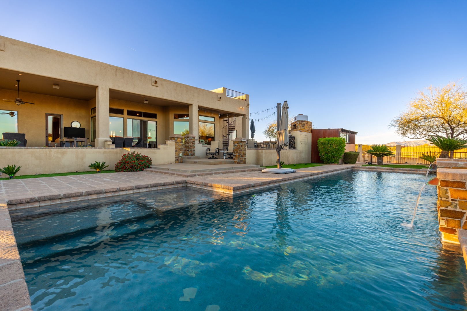 Dive into your private oasis with a sparkling pool framed by spacious patios, cozy lounge areas, and stunning views—perfect for sun-soaked days and unforgettable evenings.
