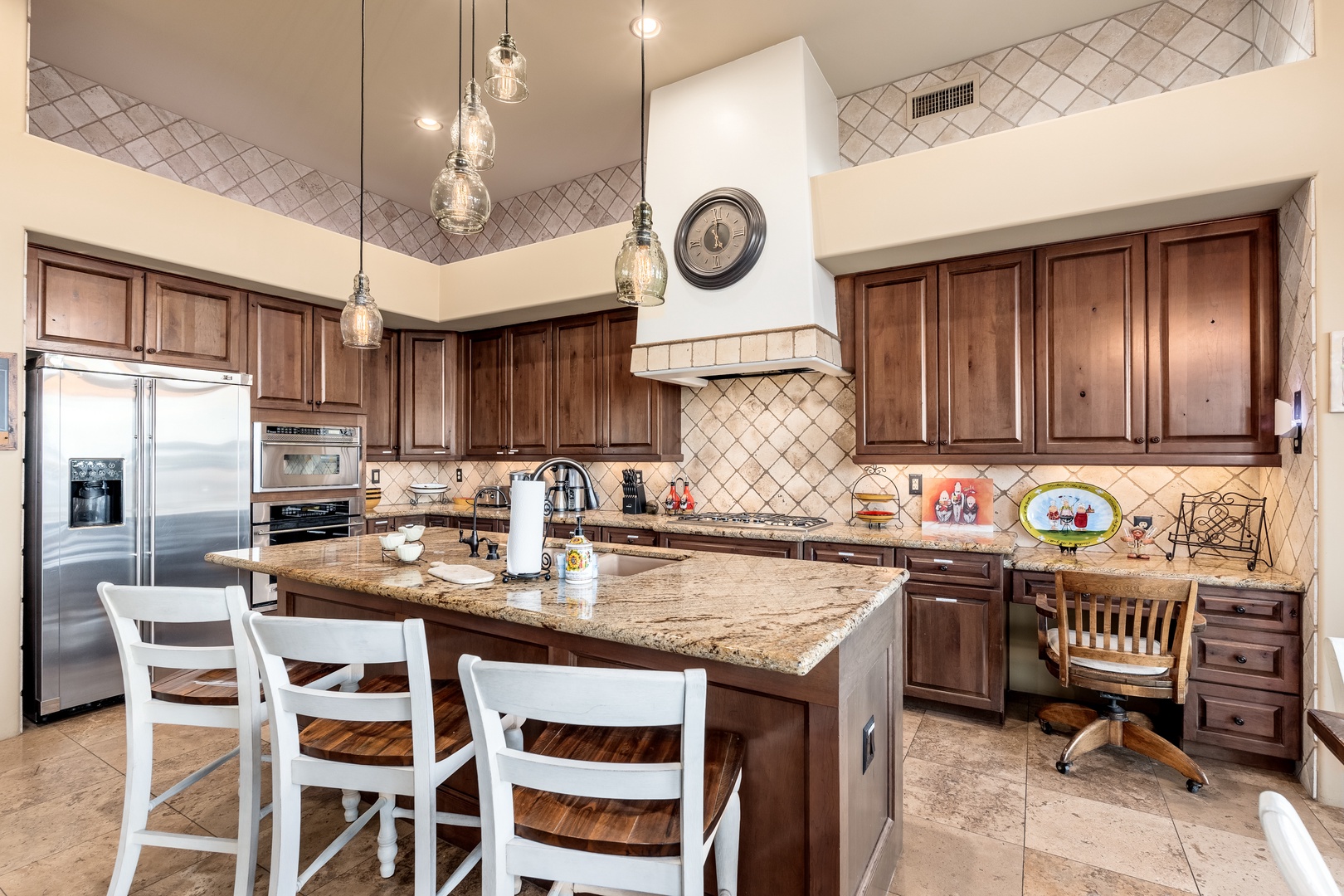 Gather around the spacious granite island in your fully-equipped gourmet kitchen, complete with stainless steel appliances, elegant pendant lighting, and all the tools you need to create memorable meals together.