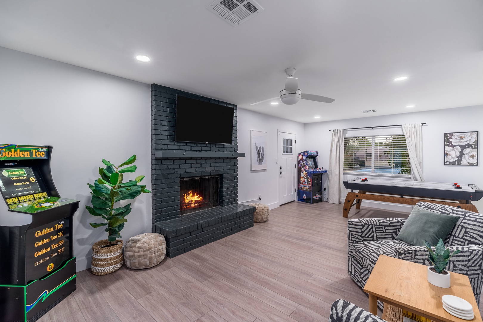 Unwind in your entertainment haven with arcade games, air hockey, and a cozy fireplace—perfect for fun-filled evenings and friendly competitions.