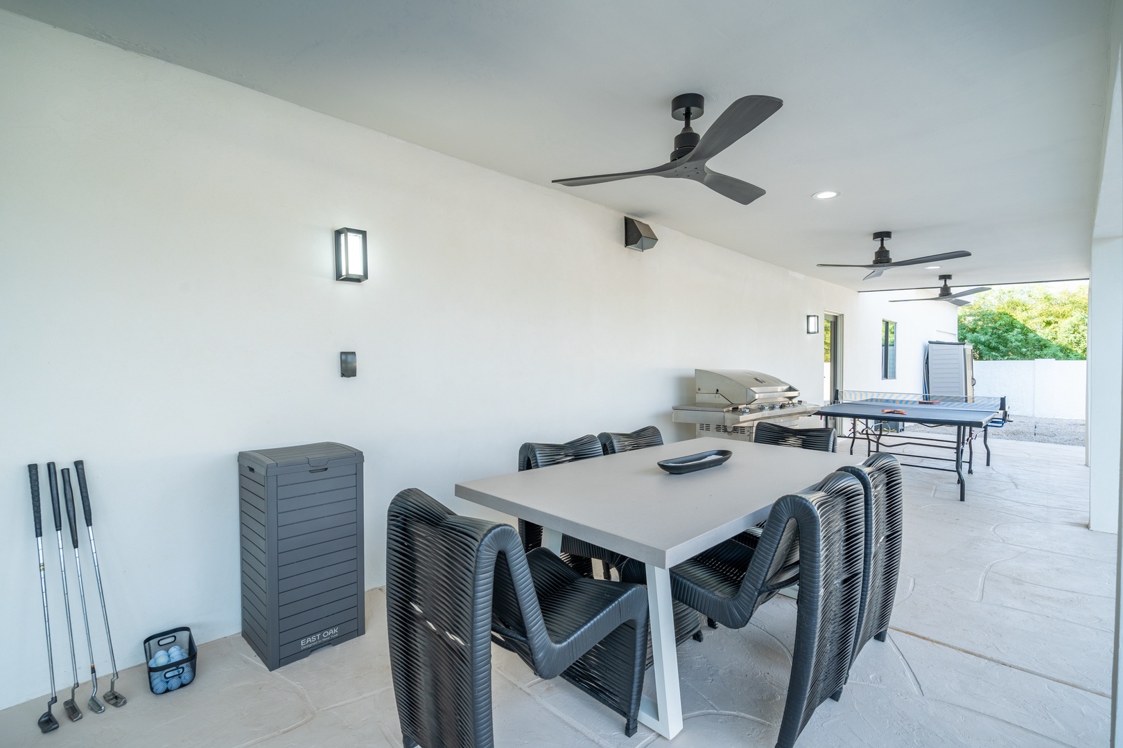 Your private covered patio offers comfortable dining, a built-in grill for cookouts, and a ping-pong table for friendly competition—perfect for relaxing or entertaining outdoors.