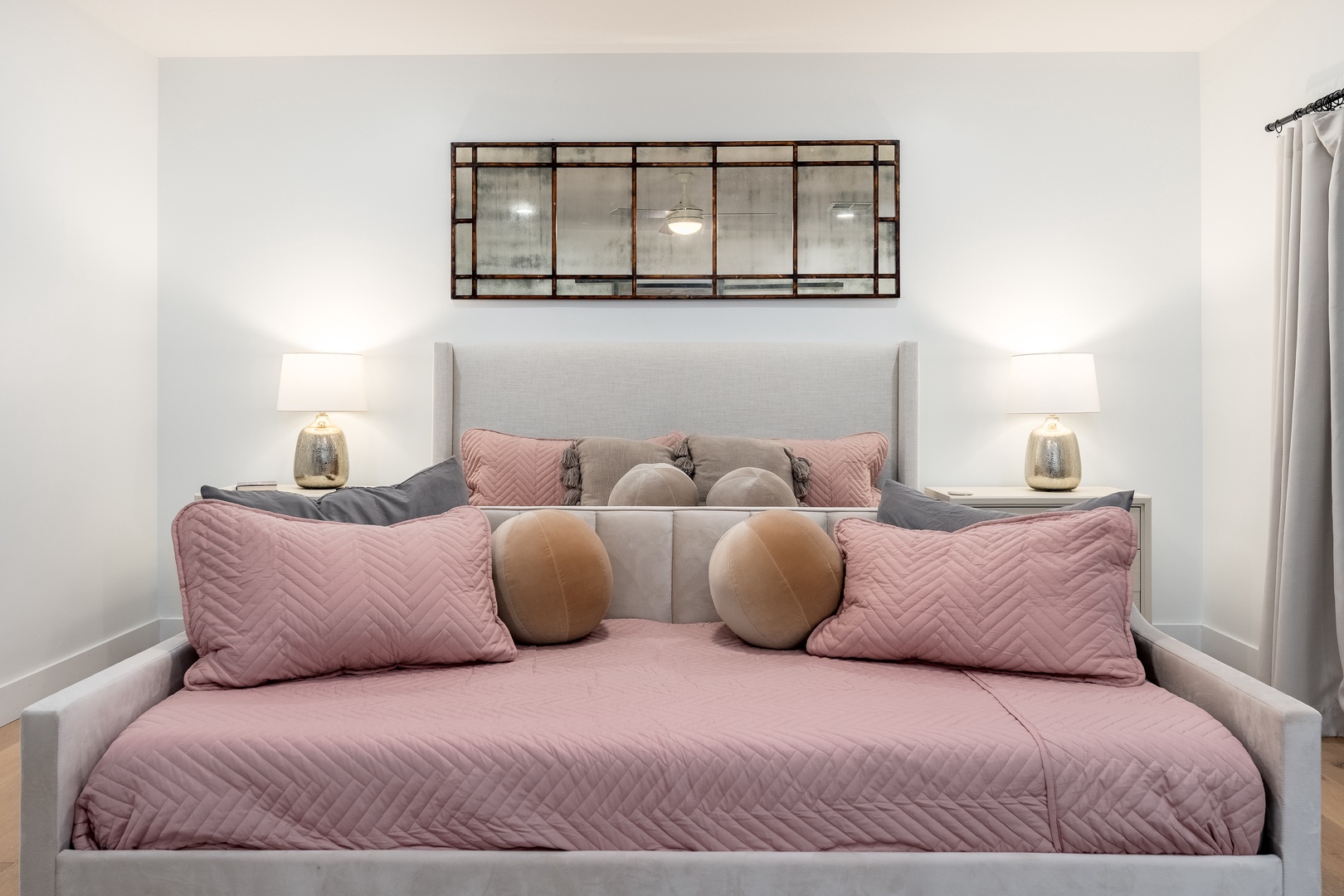 Sink into plush bedding and soft pillows in your tranquil retreat. Stylish decor and warm bedside lighting create a cozy sanctuary for restful nights.