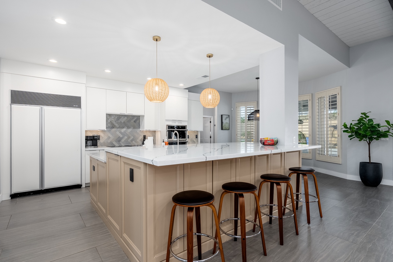 Gather around this spacious kitchen island for morning coffee or meal prep—bright, modern, and thoughtfully designed for your stay.