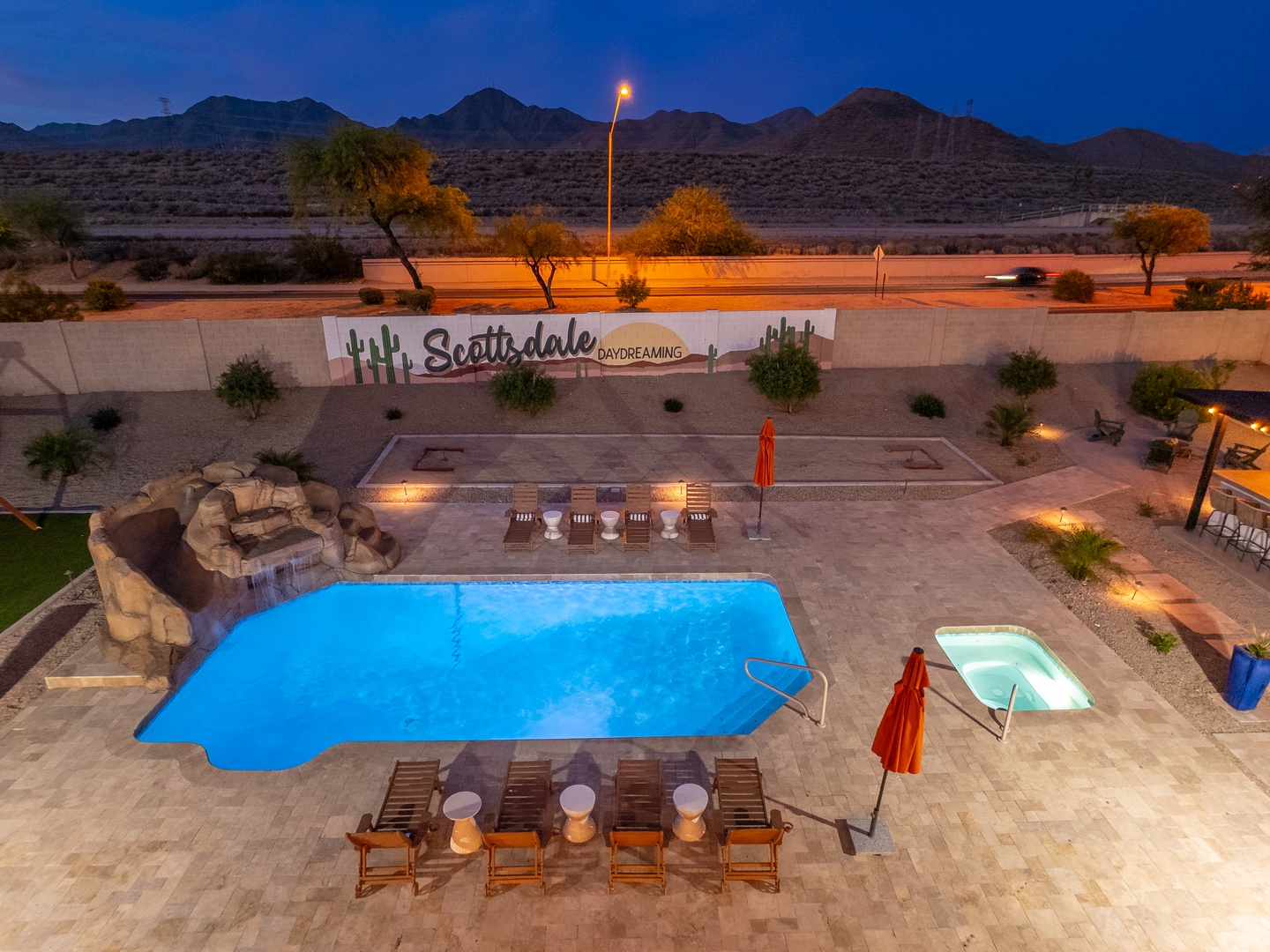 This property sits at the edge of Scottsdale, where mountains frame the horizon and desert tranquility meets easy access to the area's attractions, marked by a welcoming entrance sign.