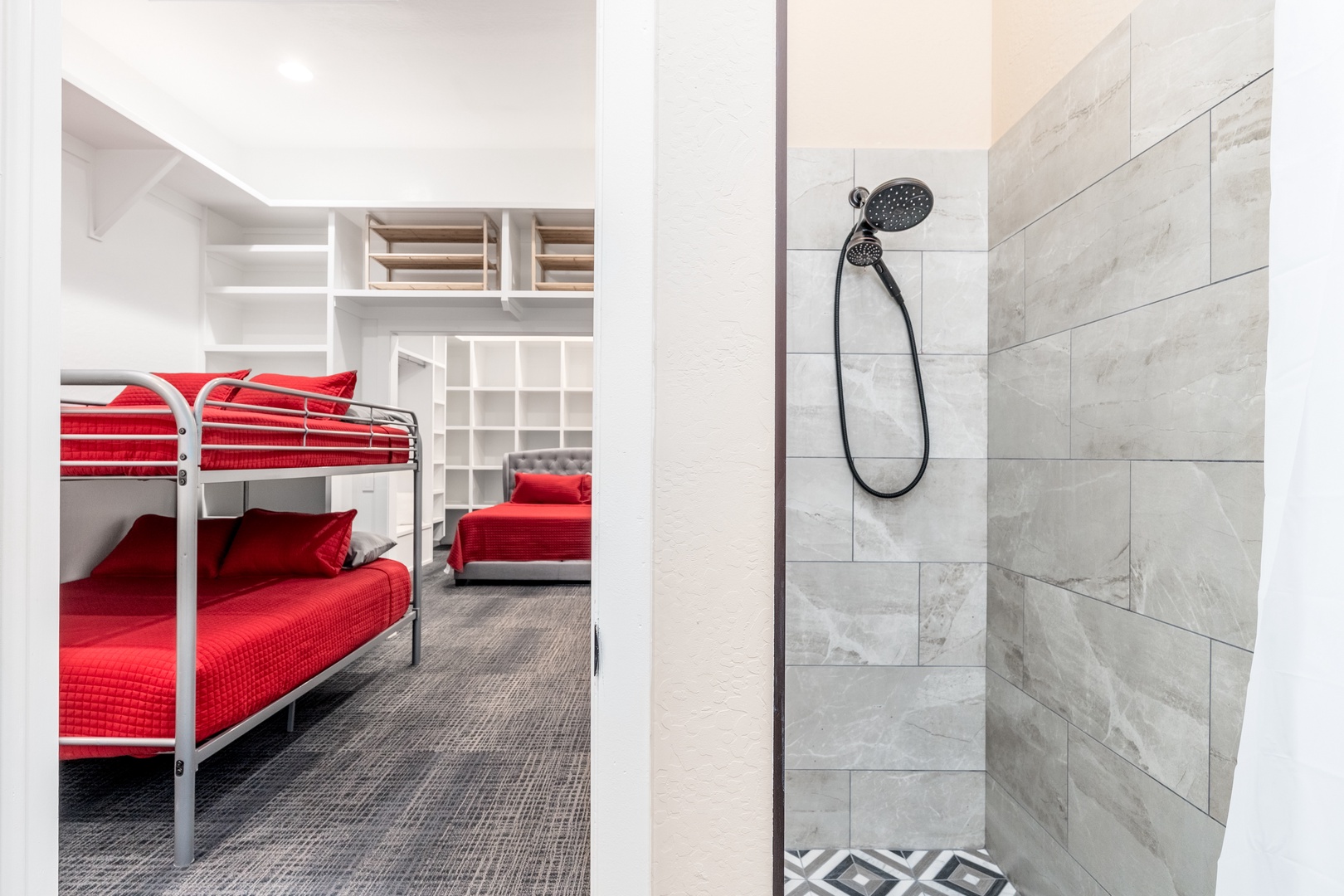 Step into your bright, modern bedroom with cozy bunk beds and a sleek shower just steps away—perfect for unwinding after a day of adventure.