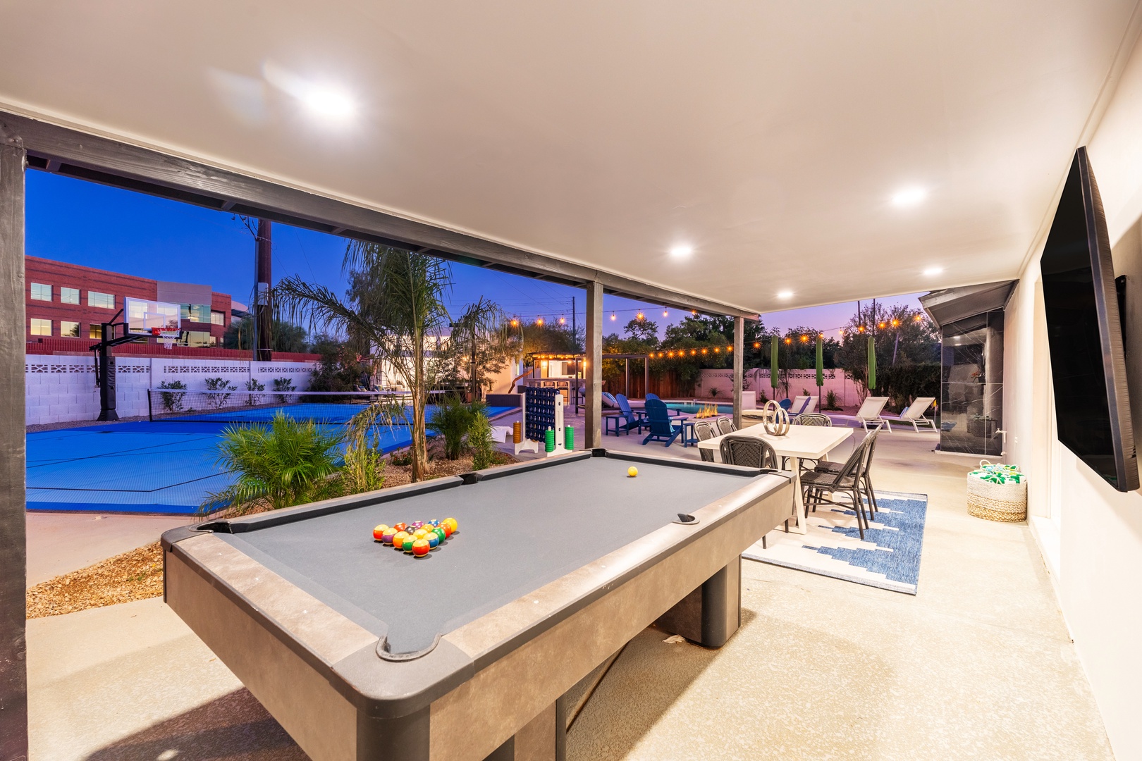 Challenge your friends to a game at the billiard table, then step outside to your private pool and patio as twilight paints the sky in beautiful hues.