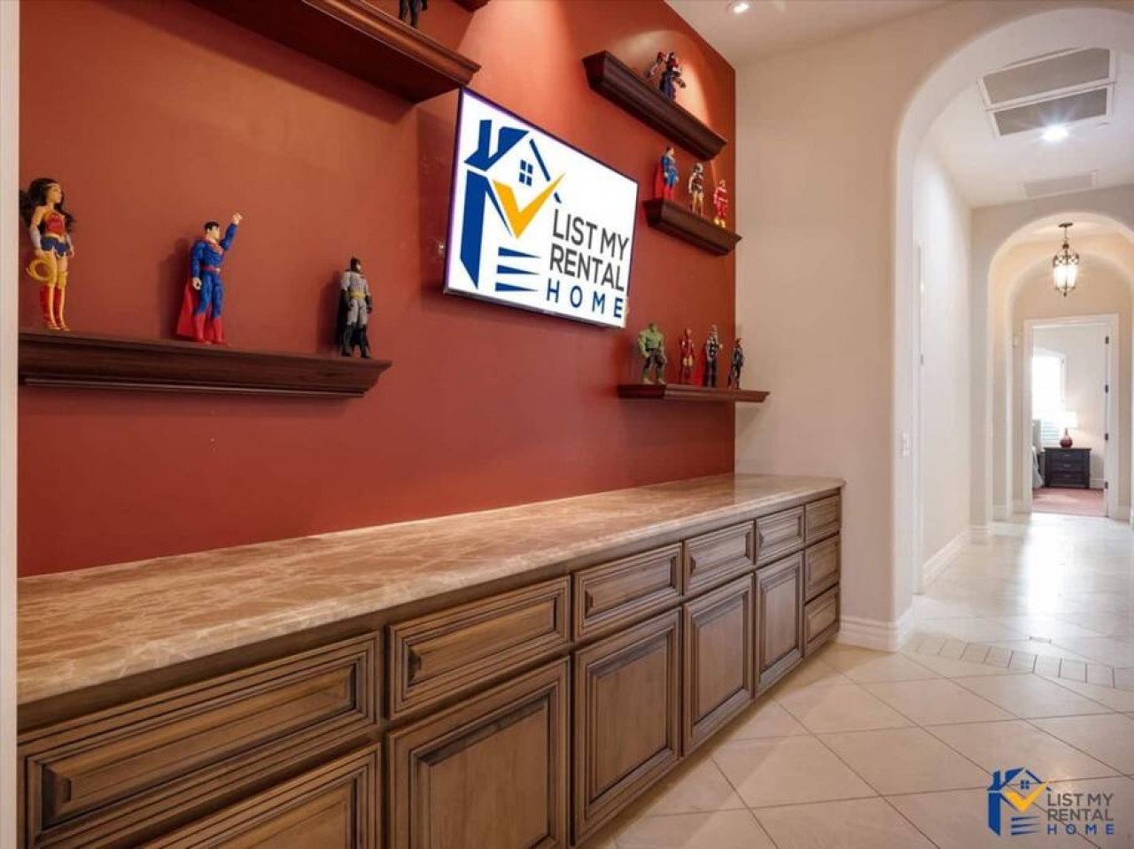 Your entertainment center features custom cabinetry with space for displays and collectibles, creating a perfect focal point for relaxation.