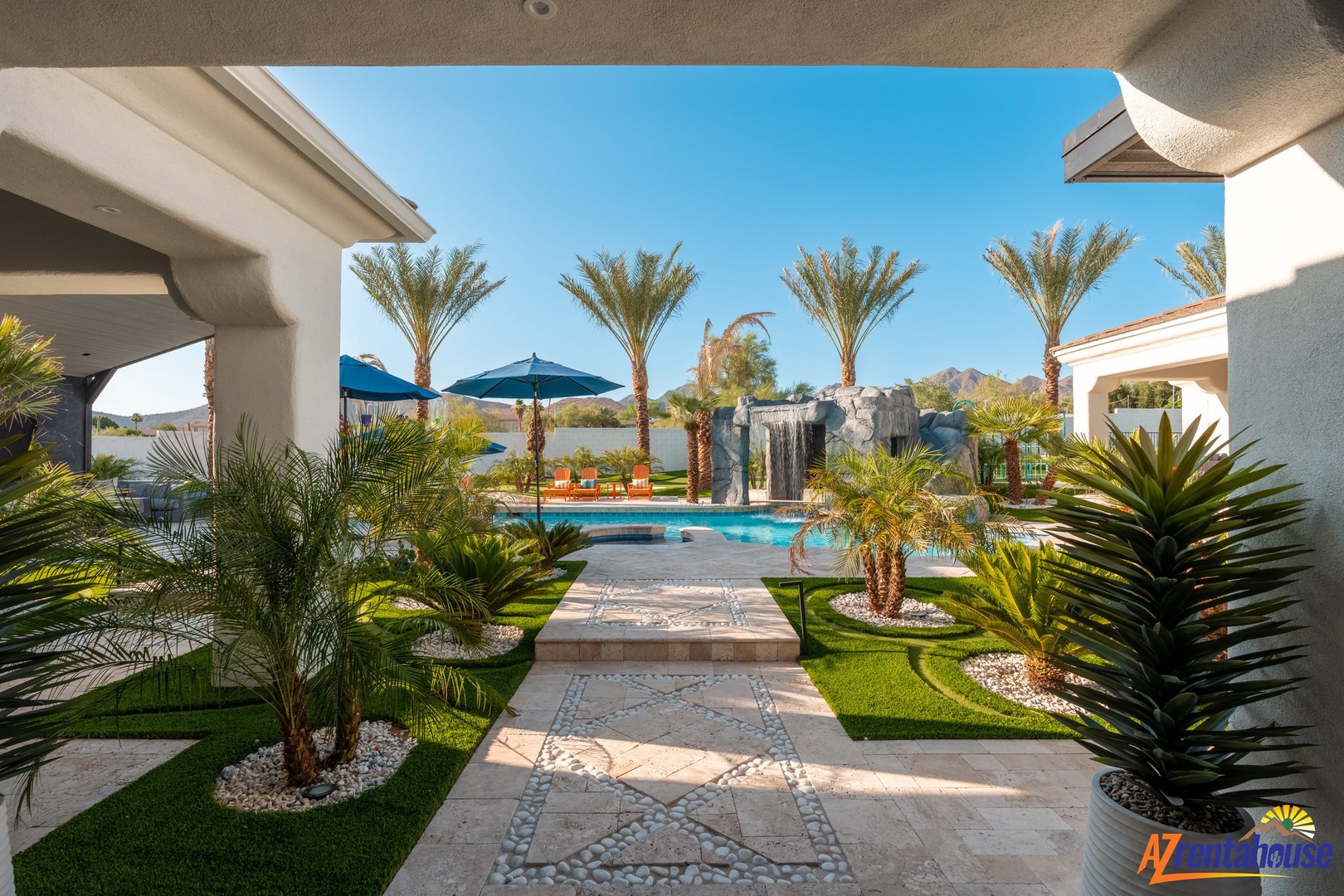Step into your private desert oasis where lush palms frame a sparkling pool, perfect for soaking up sunshine.