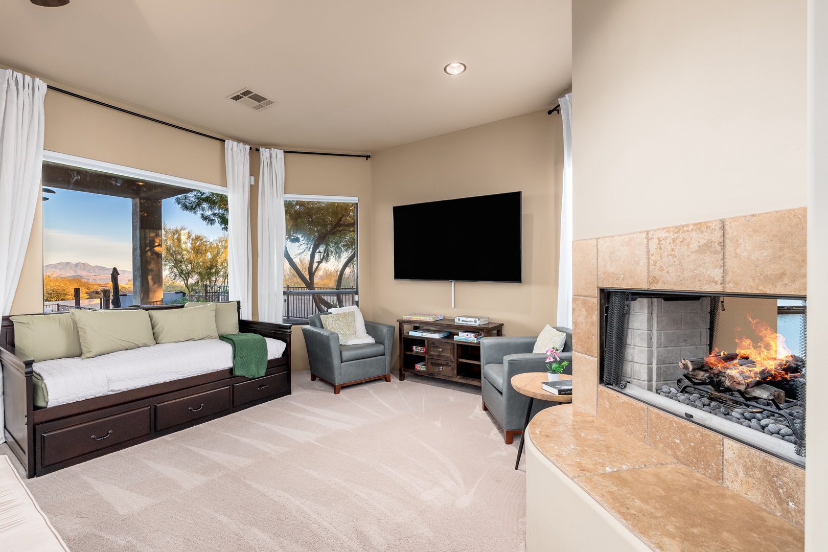 Unwind by the cozy fireplace as you take in stunning mountain views from your comfortable living space—your perfect retreat awaits.