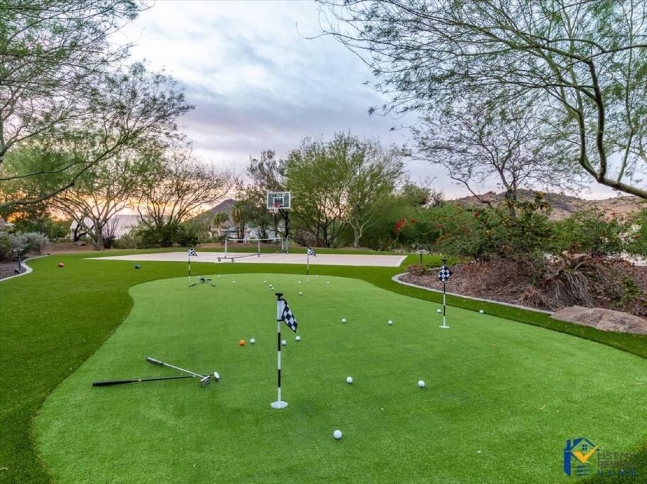 Practice your putting on this private putting green, complete with multiple holes and flags for perfecting your short game.