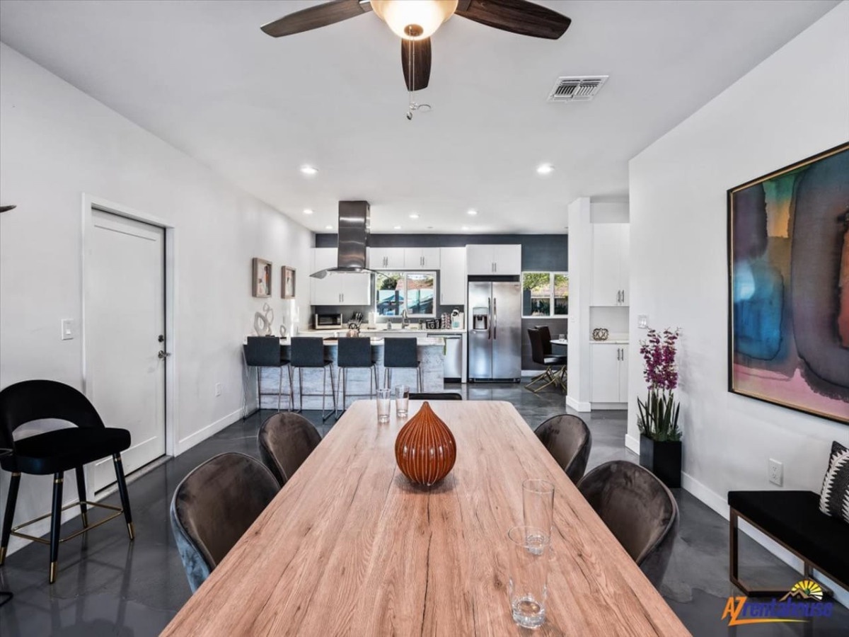 Gather around your spacious dining table while the chef in your group creates memorable meals in the modern kitchen beyond.