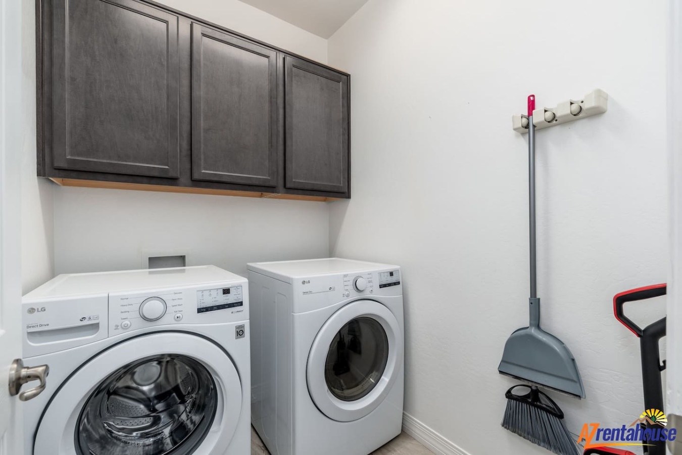 Your private laundry room features modern appliances and ample cabinet storage for effortless cleaning during your stay.