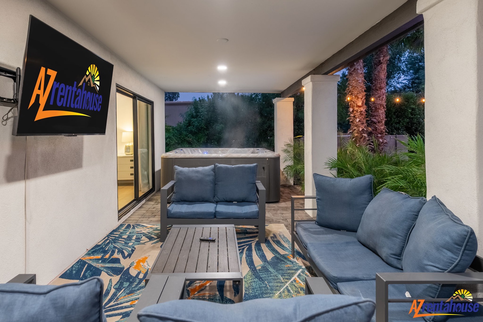Unwind in your private patio oasis with plush seating, soothing hot tub, and tropical garden views—perfect for evening relaxation.