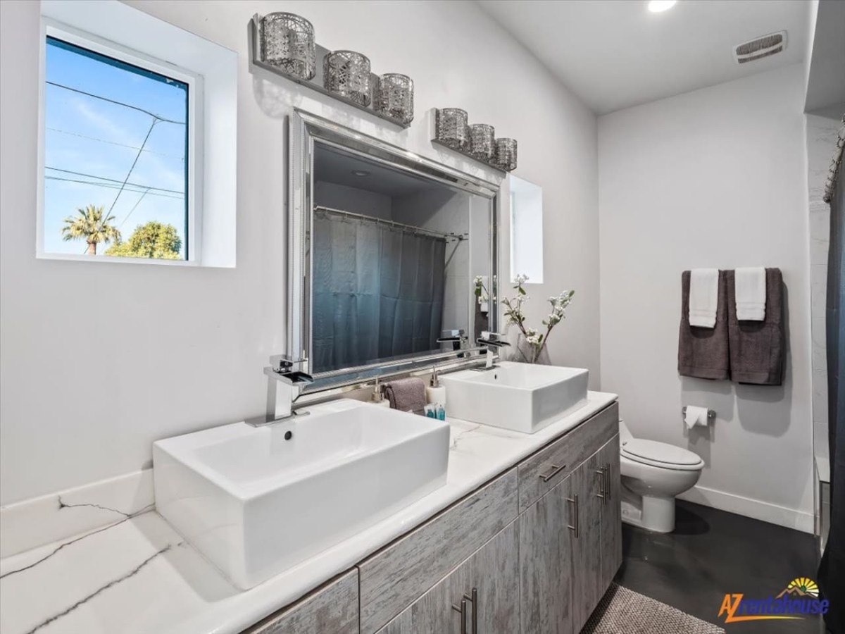 Step into your modern sanctuary with dual sinks, sleek fixtures, and spa-like lighting—perfect for your morning routine.