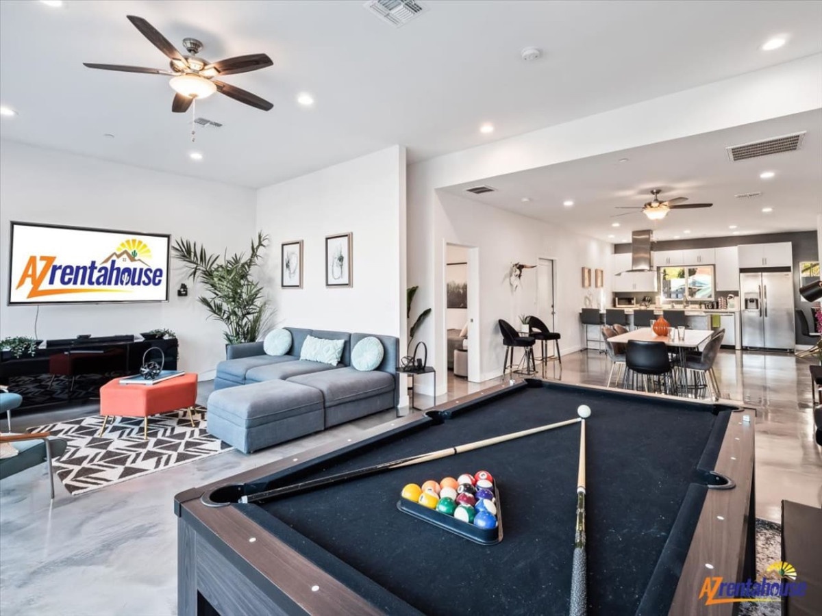 Gather friends for pool games in your stylish entertainment space, then unwind in the comfortable living area.