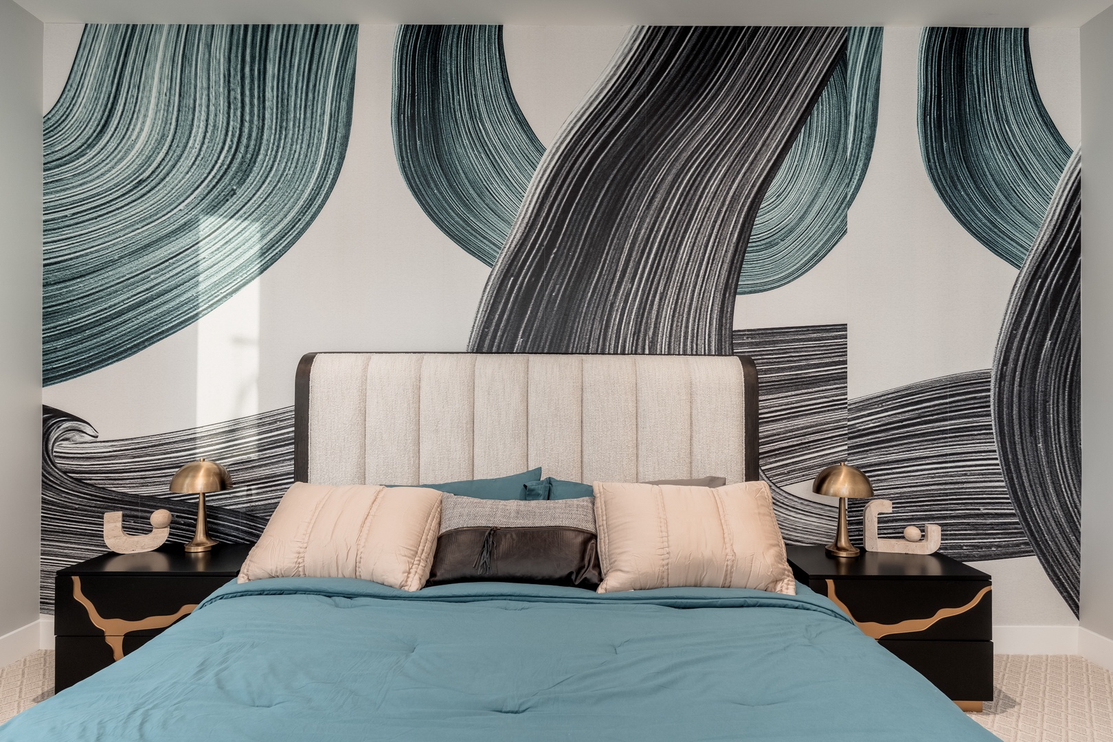 Slip into luxurious linens and wake up to stunning art. Your bedroom combines plush comfort with bold style—perfect for peaceful nights and creative mornings.