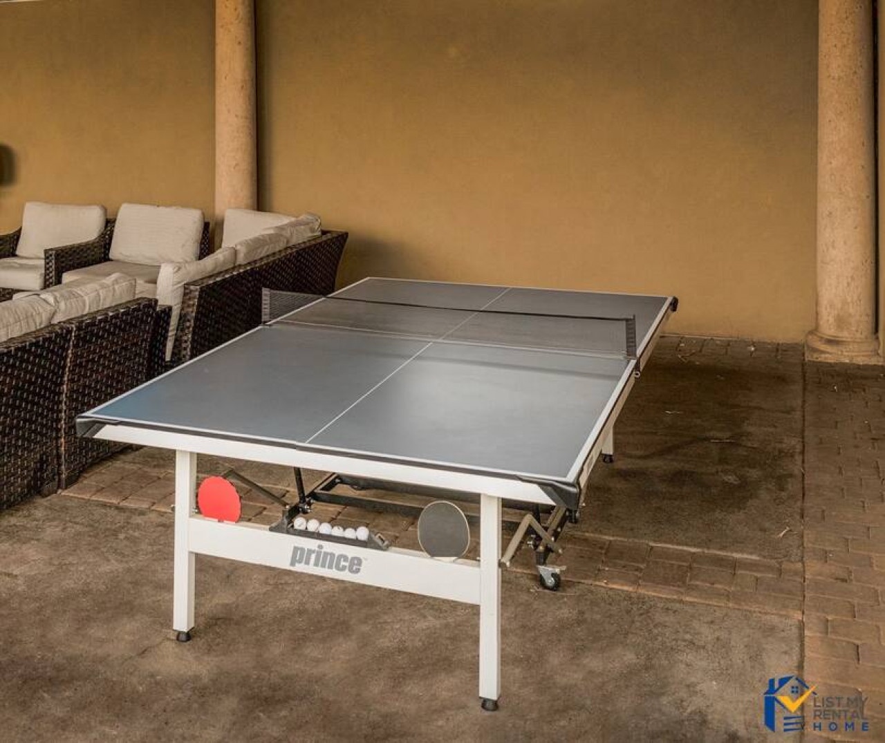 Challenge friends to ping pong matches on your covered terrace, with comfortable seating nearby for spectators and relaxation.