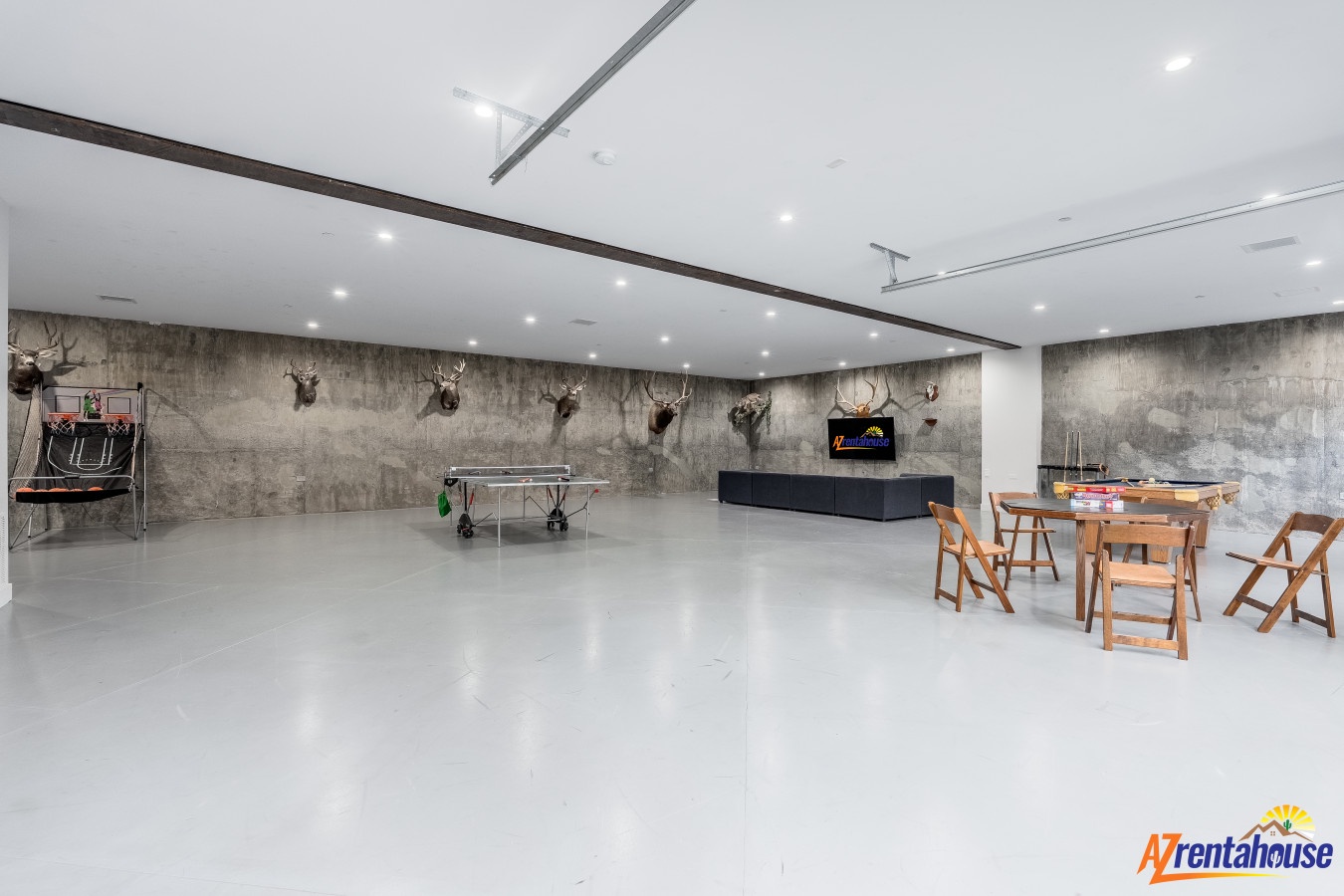 Your entertainment space features a ping pong table, large TV, and card table for hours of indoor fun.