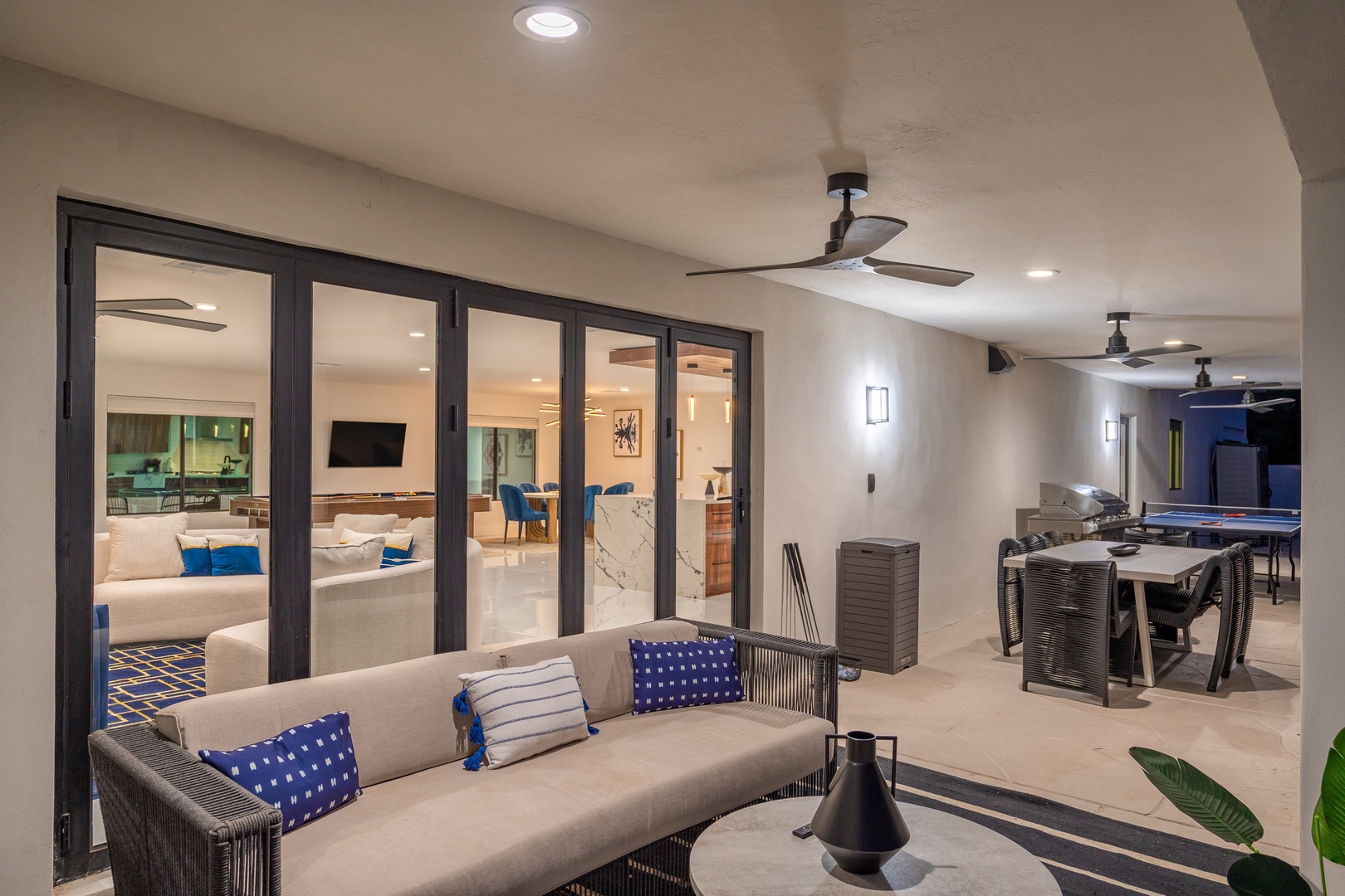 Your private outdoor living space flows seamlessly into the bright, modern interiors—perfect for evening relaxation under ceiling fans with friends and family nearby.