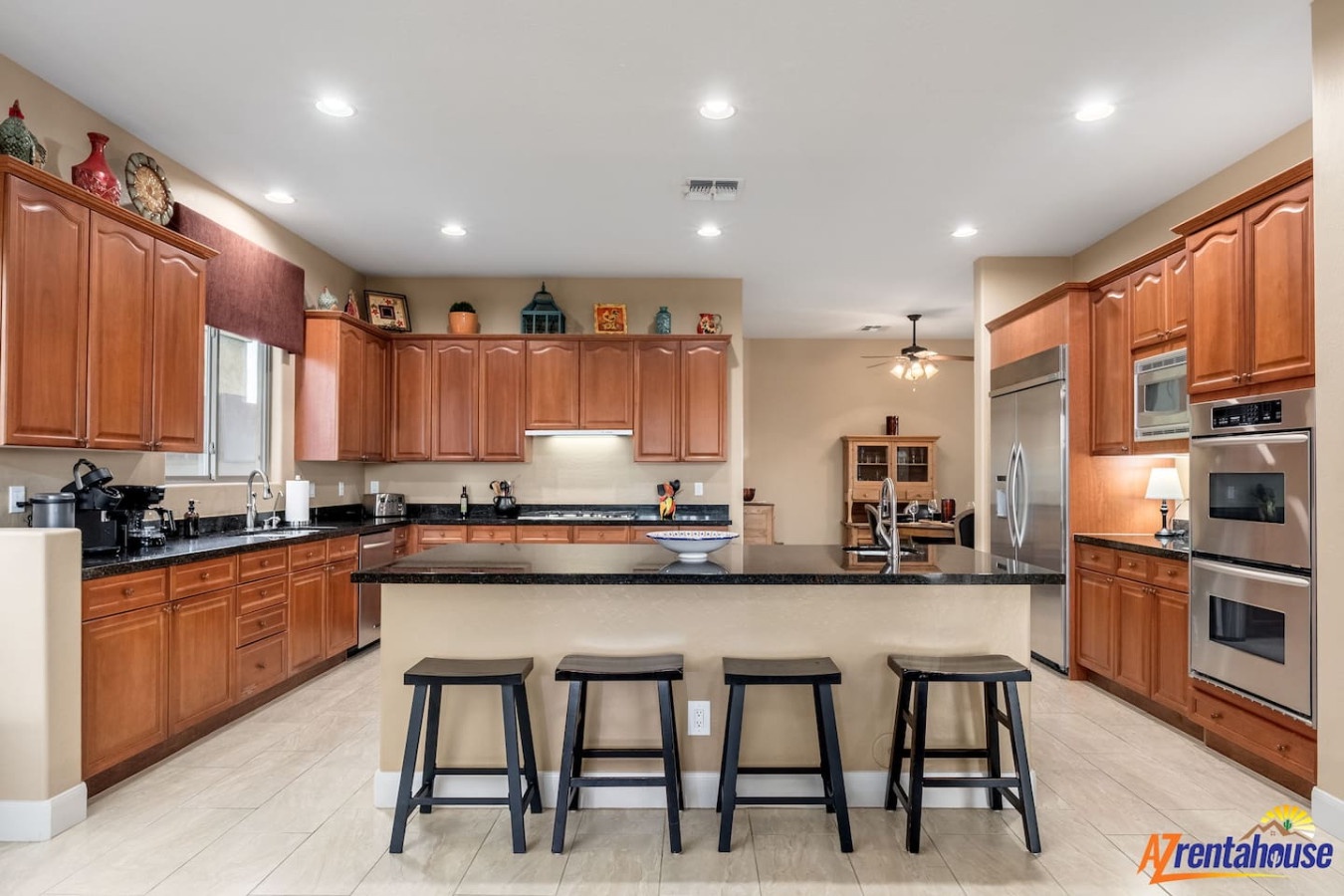 Gather around the spacious granite island with bar seating, where you'll find everything needed to create memorable meals together.