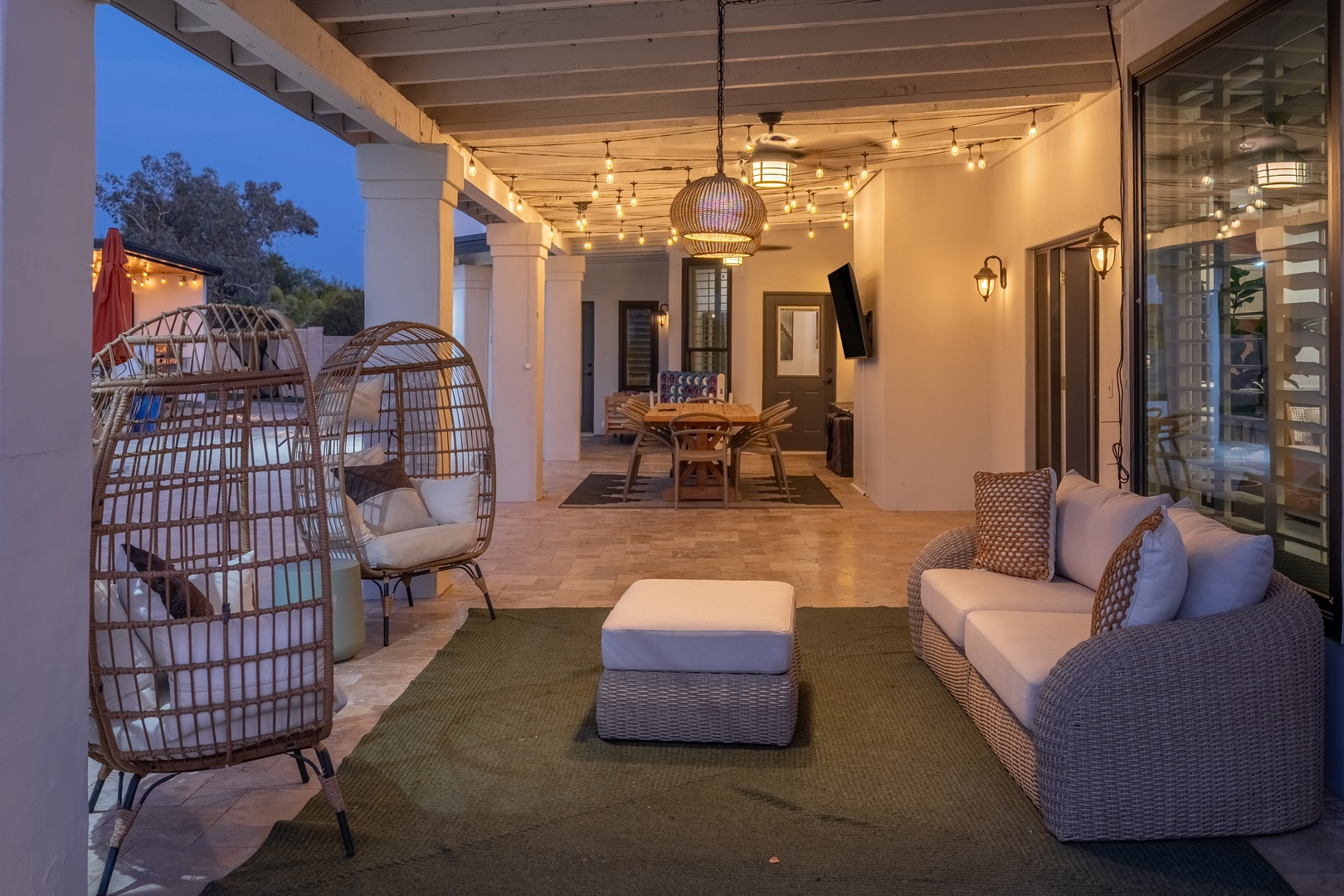 Unwind in your private covered patio, where plush seating and ambient lighting create the perfect spot to relax after a day of adventure.