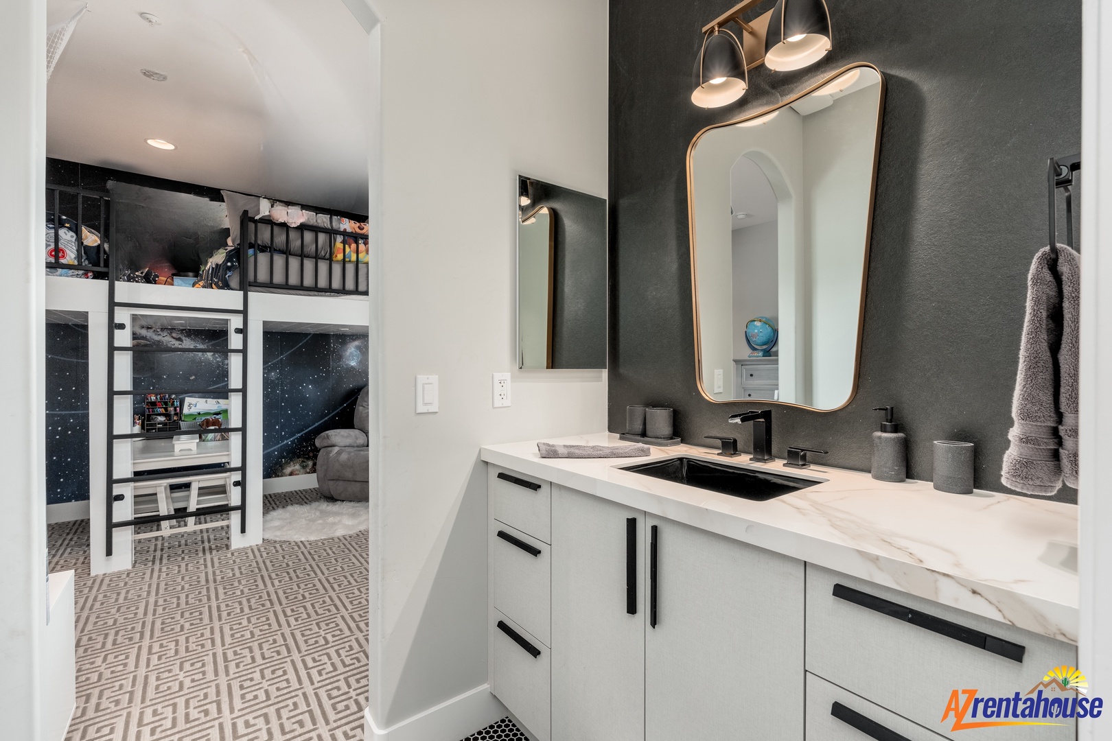 Your modern bathroom features sleek marble countertops, elegant lighting, and a stylish mirror perfect for your morning routine.