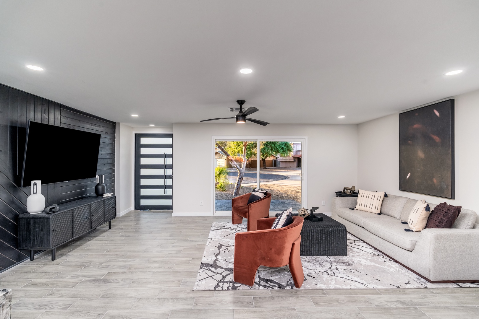 Unwind in your modern living space featuring sleek design, plush seating, and natural light streaming through the glass doors. Your perfect retreat for relaxation and connection.