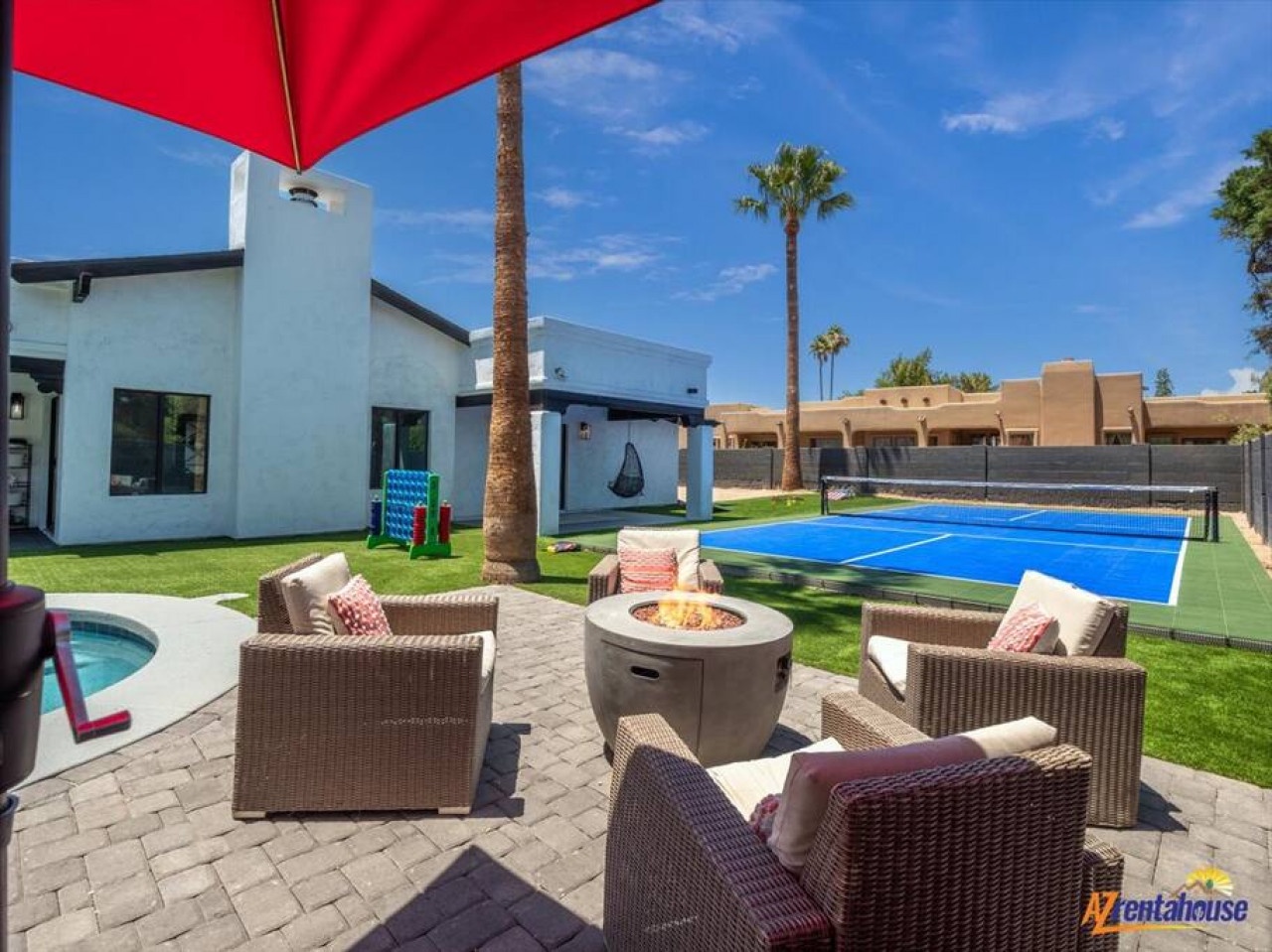 Your private desert oasis awaits with comfortable seating around a warm fire pit, perfect for evening conversations under the stars.