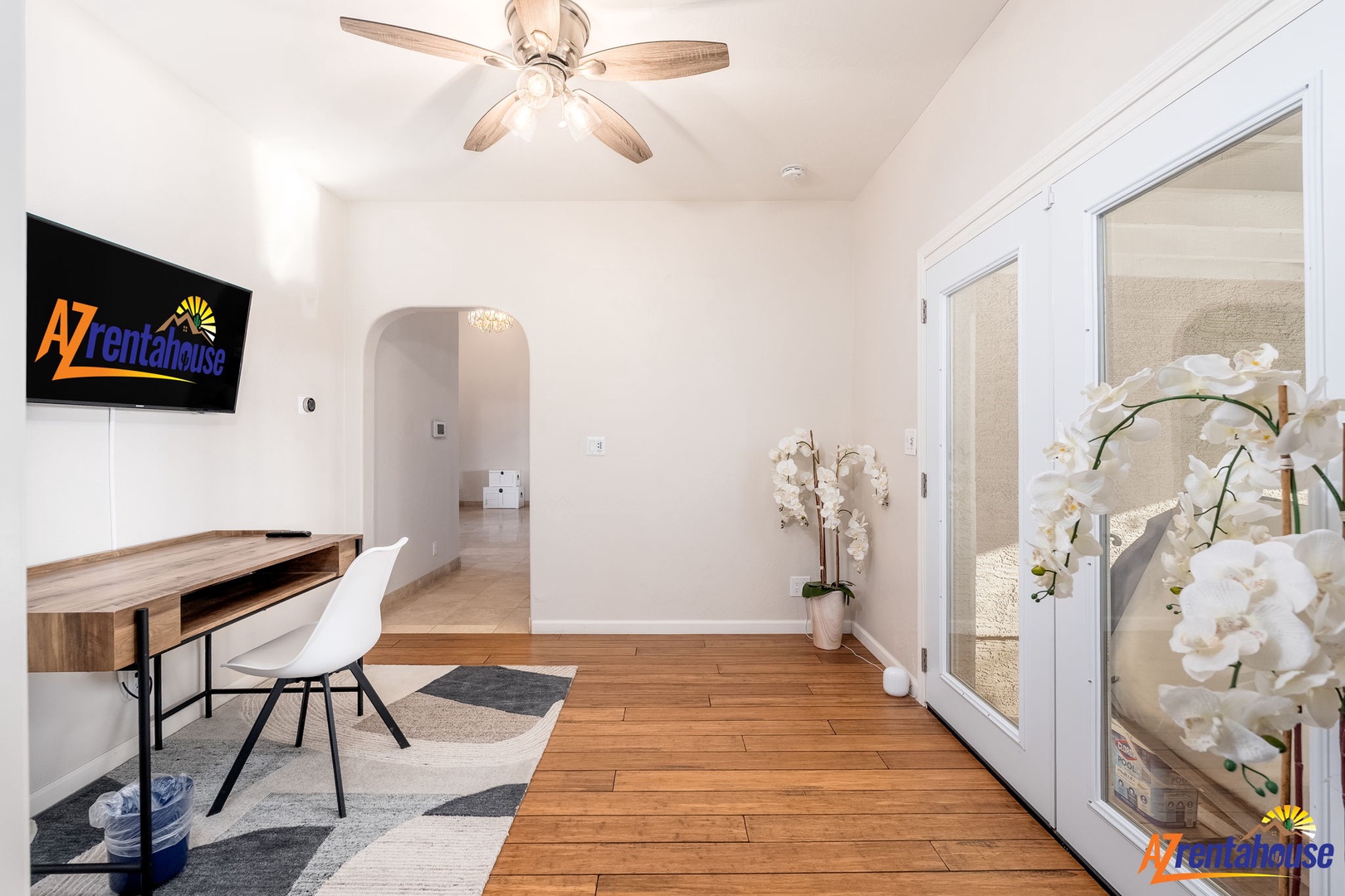 Settle in at your cozy workspace, where natural light and thoughtful touches like fresh orchids create a calm, inspiring spot for remote work or planning your adventures.