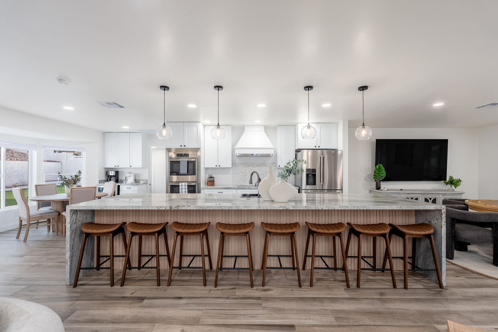 Gather around this stunning kitchen island with seating for eight, where you can enjoy morning coffee or evening cocktails while the chef prepares your favorite meals in this chef-inspired space.