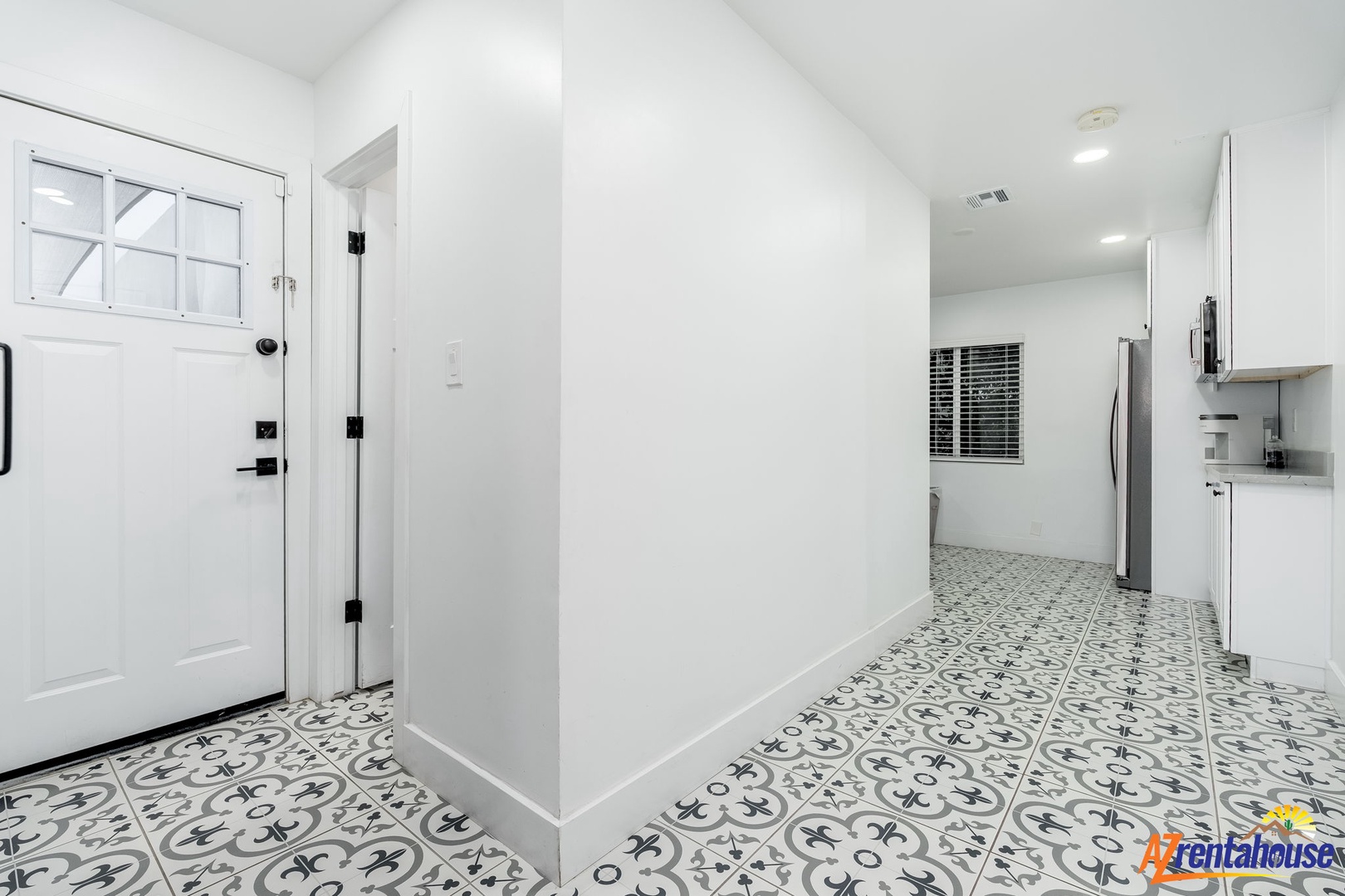 Step into your bright, modern space featuring stunning patterned tiles that flow throughout, creating an artistic foundation for your stay.